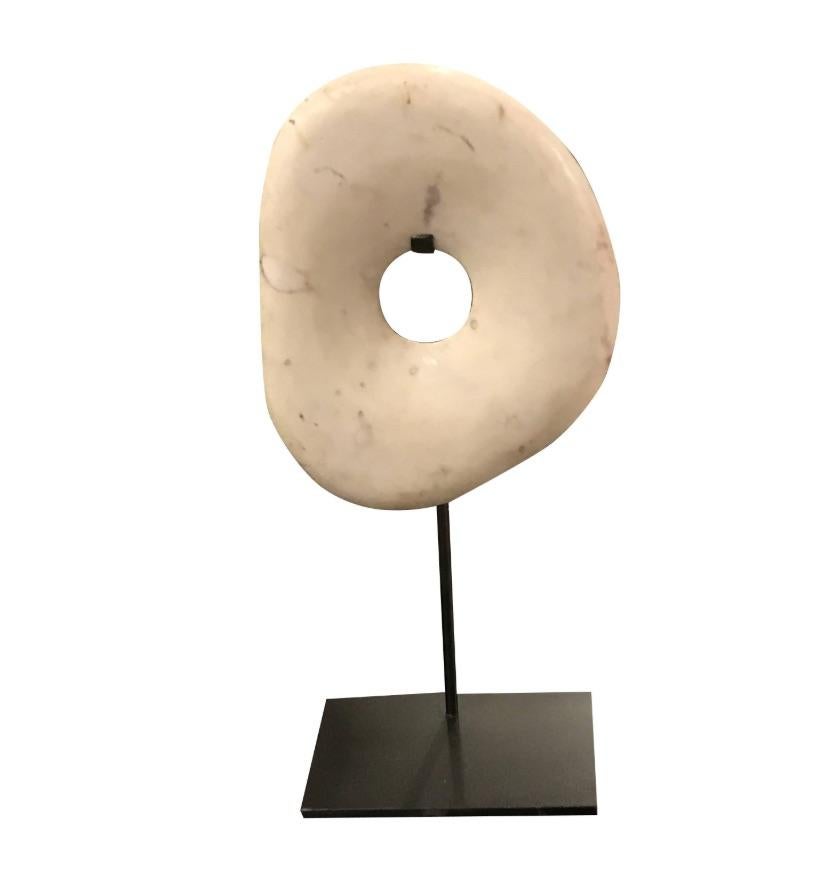 Contemporary Indonesian vertically shaped smooth white stone disc on stand.
Makes a nice collection with S4866A and S4866B.