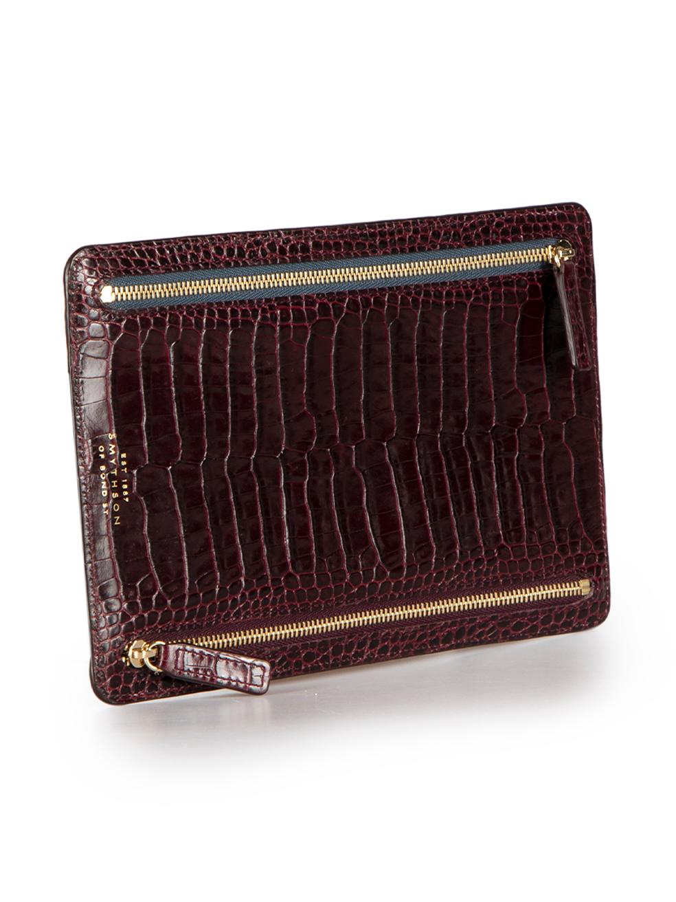 CONDITION is Very good. Hardly any visible wear to pouch is evident on this used Smythson designer resale item.

Details
Burgundy
Leather
Pouch
Aligator embossed pattern
4x Zipped pockets
 
Composition
EXTERIOR: Leather
INTERIOR: Cloth textile

Size