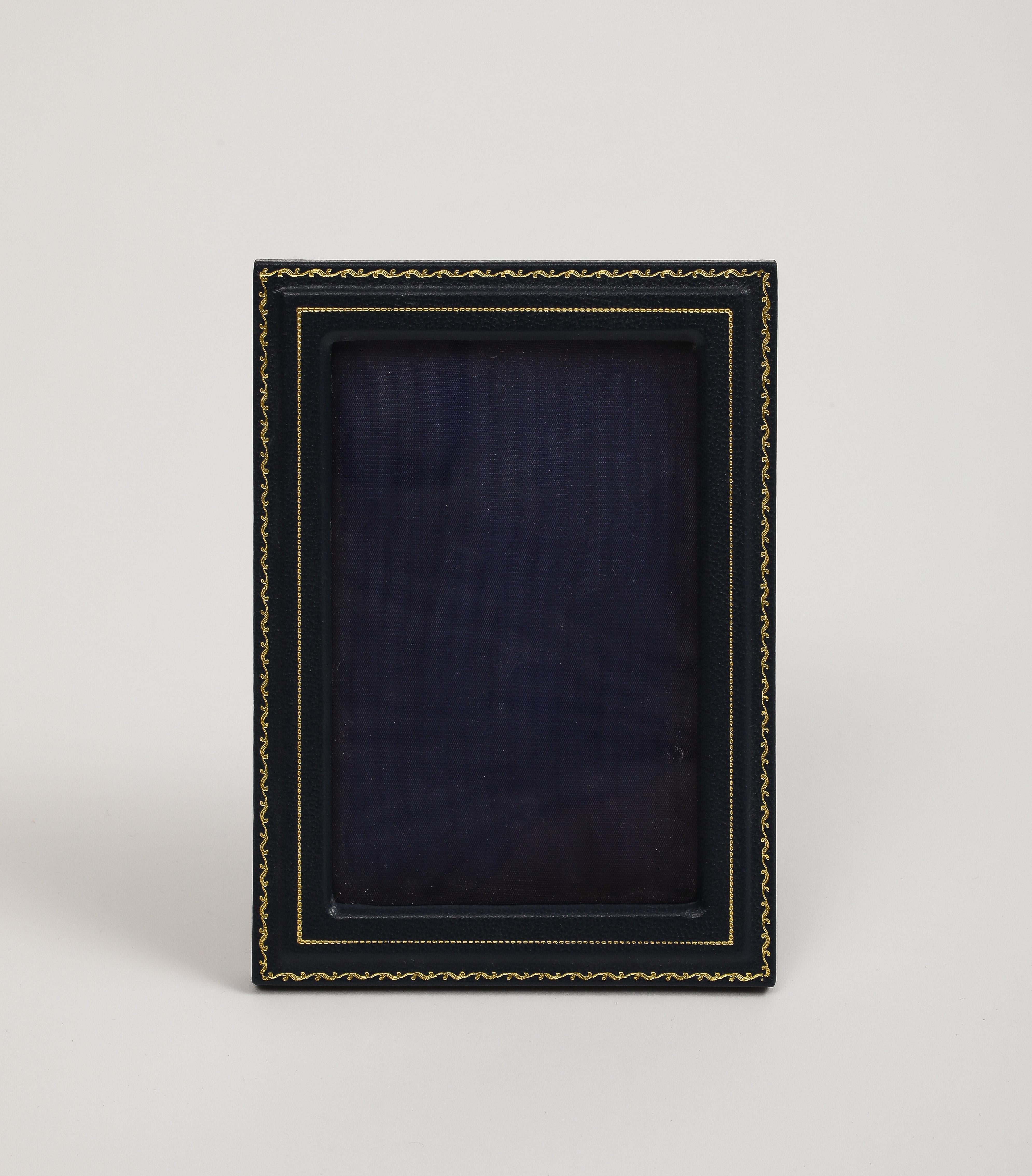 English navy blue leather picture frame with hand-painted gold accents by Smythson of Bond Street. 

7 1/4