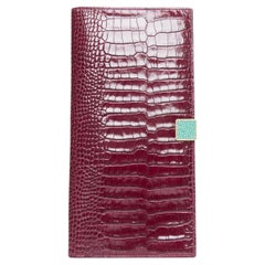 SMYTHSON Mara burgundy croc embossed high gloss teal clasp passport cover
