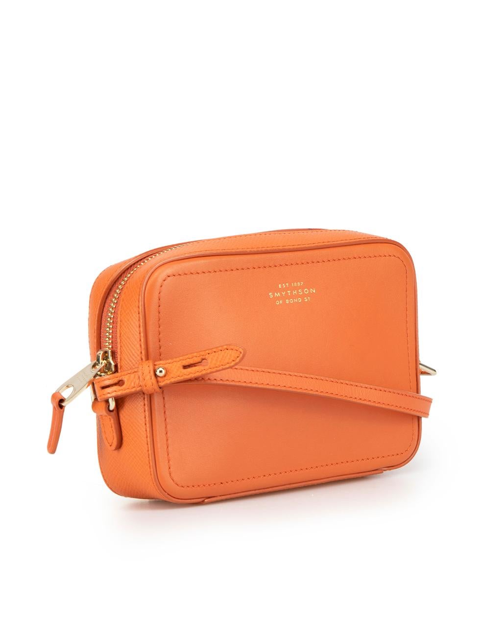 CONDITION is Very good. Hardly any visible wear to handbag is evident. A dark scuff on the piping near the zip on this used Smythson designer resale item.

Details
Orange
Leather
Mini crossbody bag
Gold tone hardware
1x Adjustable strap
1x Main