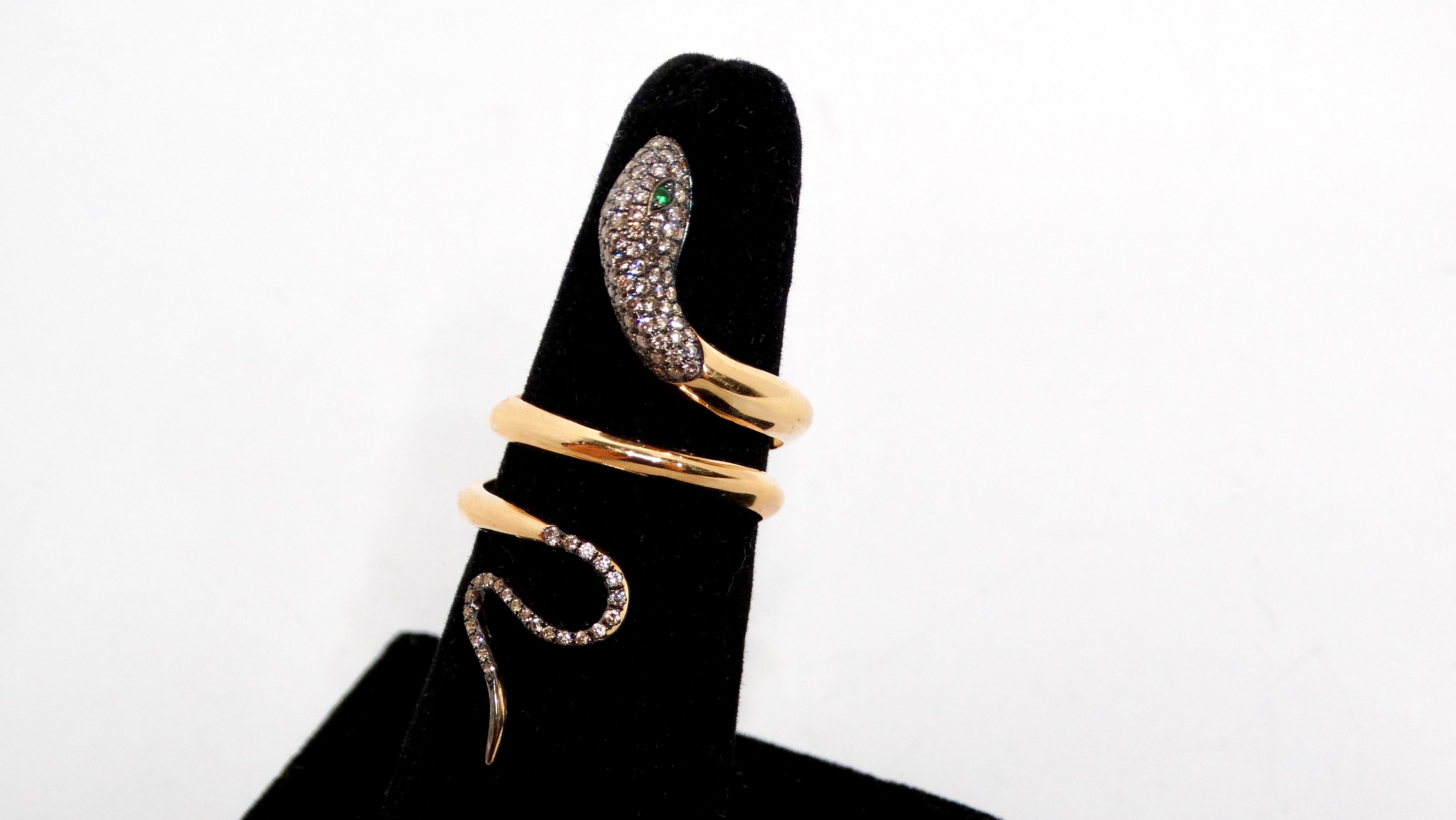 Introducing the exquisite Snake 18k Gold Ring, a stunning embodiment of elegance and sophistication. Crafted from luxurious yellow gold, this enchanting ring features a serpentine design where the snake wraps gracefully around your finger, creating