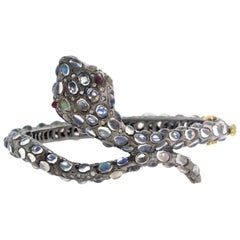 Snake Bangle in Gold and Silver with Diamonds and Moonstone