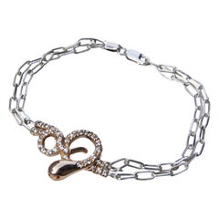 Pulsera con forma de serpiente, con pavé de diamantes, ojo de rubí y cadena de eslabones de plata de ley