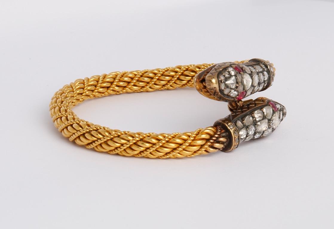 Snake Bracelet set by rose cut diamonds and rubies.
Antique Ottoman Empire. Early 20th Century.
Heads width: 0,98 inch (2.5 centimeters)
Length of head: 1,18 inch (3 centimeters)
Size: 1.97x1.97 inch (5x5 centimeters)