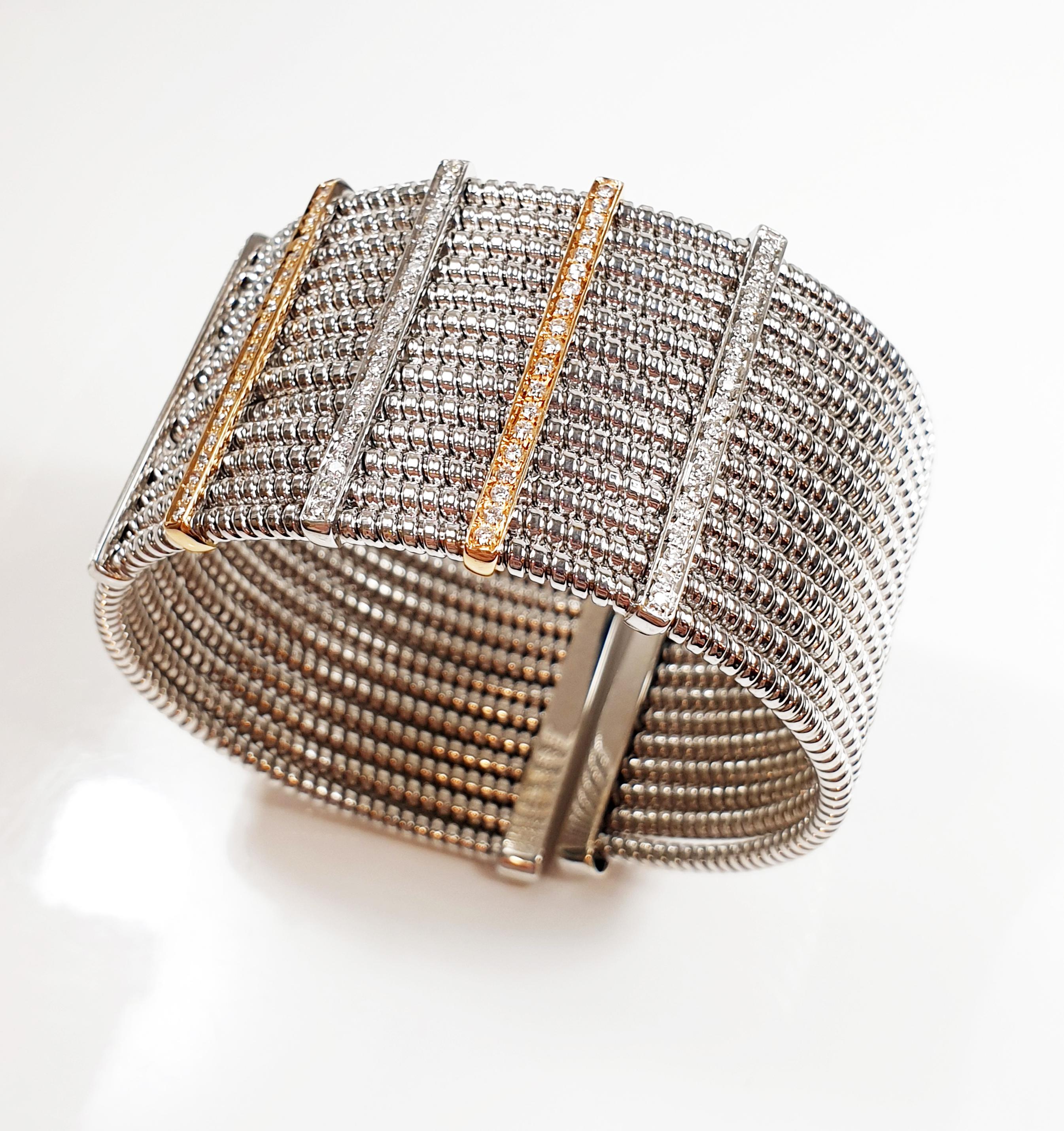 Opened, semi-elastic cuff  bracelet with 13 hoops crossed by aternate white and rose gold bars with clean, white diamonds.
Stylish, sportive and very wearable Bracelet  
Snake chain this kind of fabrication owes its description to the elasticity and