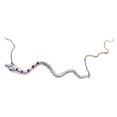 Collana a girocollo a forma di serpente con rubino, tanzanite, argento e catena d'oro a forma di serpente