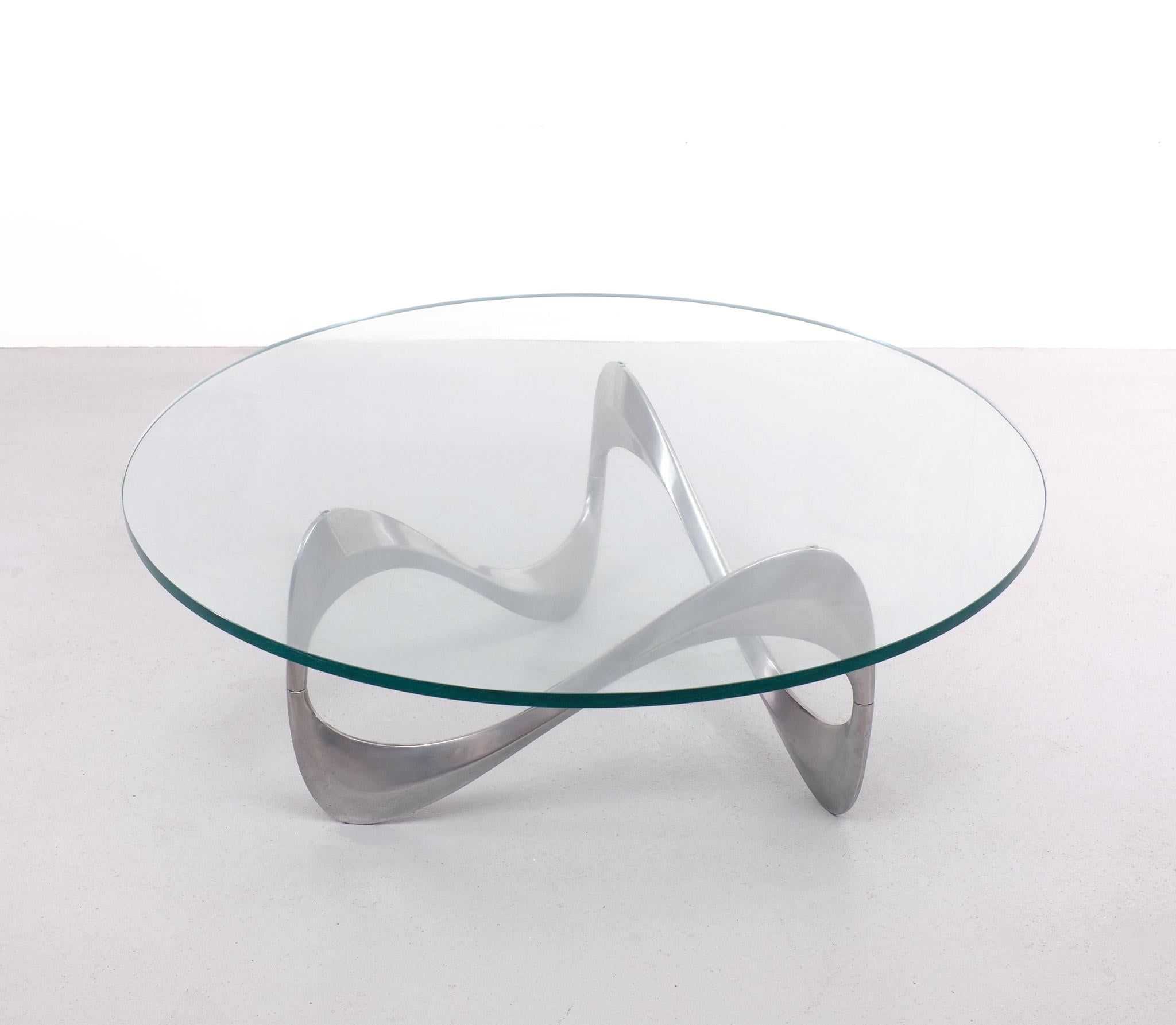 Beautiful Iconic ’Snake’ coffee table designed in 1965 by Knut Hesterberg for Ronald Schmitt Organic shaped aluminum base supports heavy round shaped original glass top Table is in good condition, aluminum base has very moderate traces of tear and