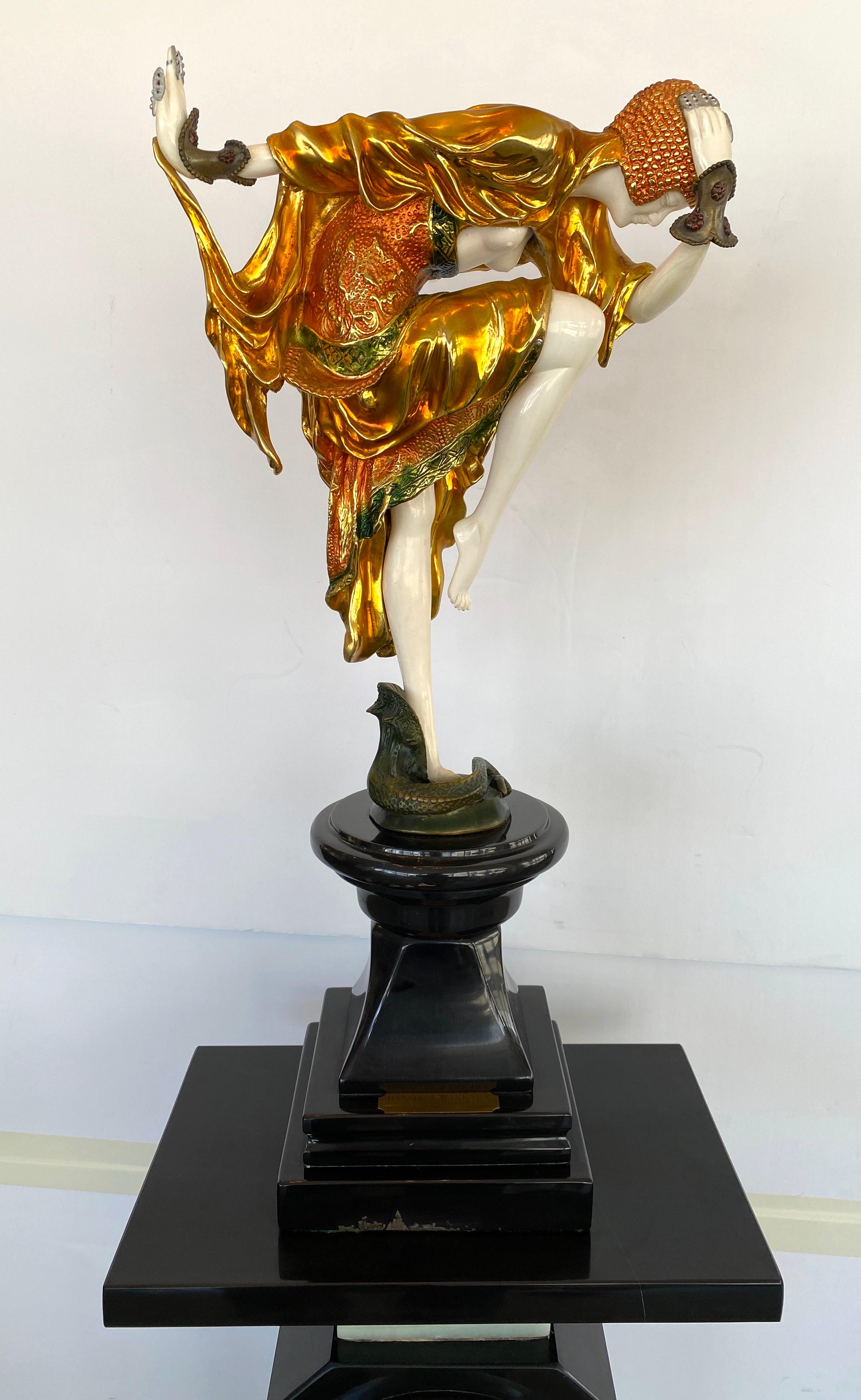 This stylish and chic Art Deco style sculpture is after the Snake Dancer sculpture by the Romanian-born sculptor Demtre Chiparus, which was originaly created in 1925.

The piece is finished in a polychrome, patinated coloration.
 
Note: Overall