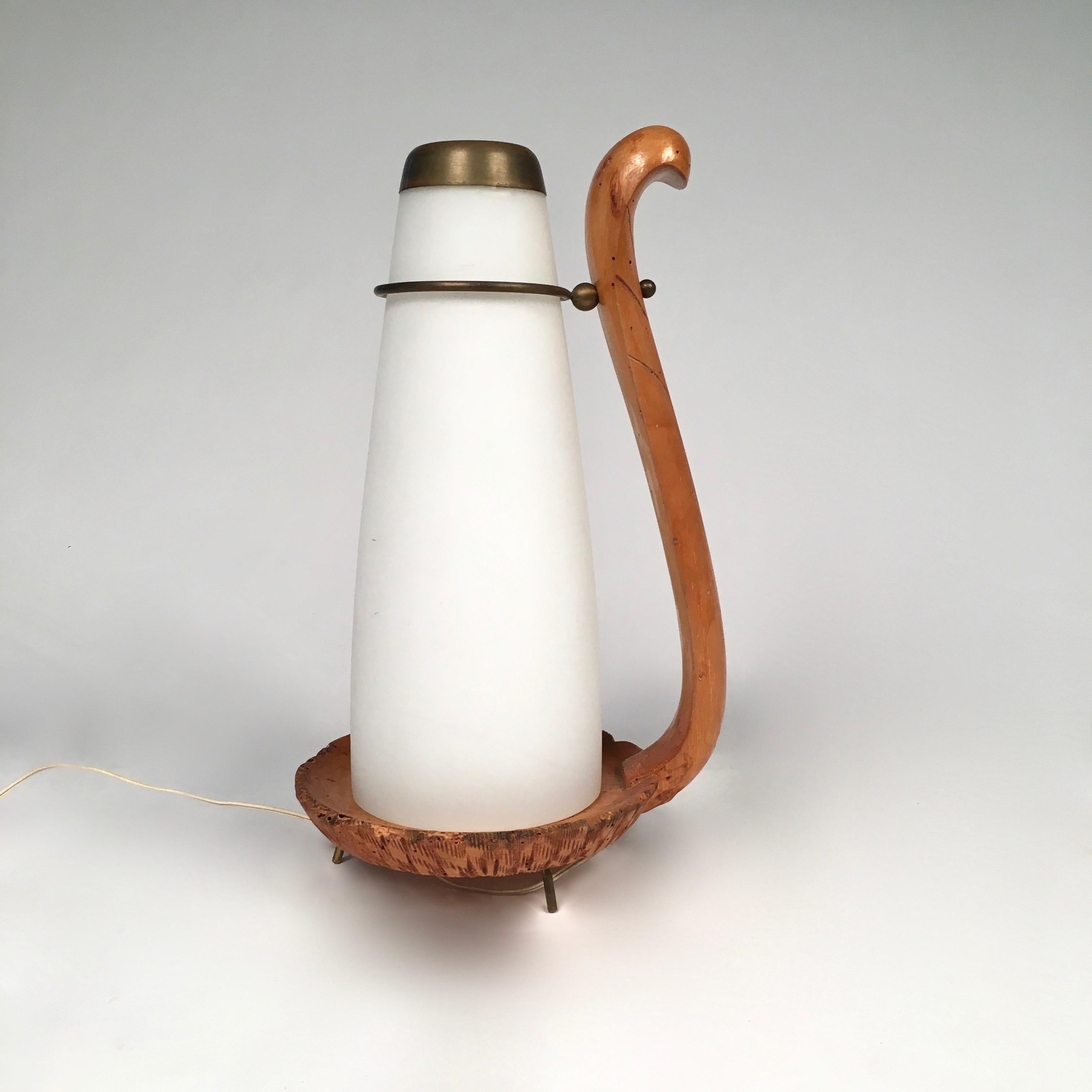 This particular and sophisticated snake lamp made by Aldo Tura is most likely a unique protoype lamp. Aldo Tura lamps were done in small editions, thus the details and level of sophistication in carving on this particular lamp would be impossible to