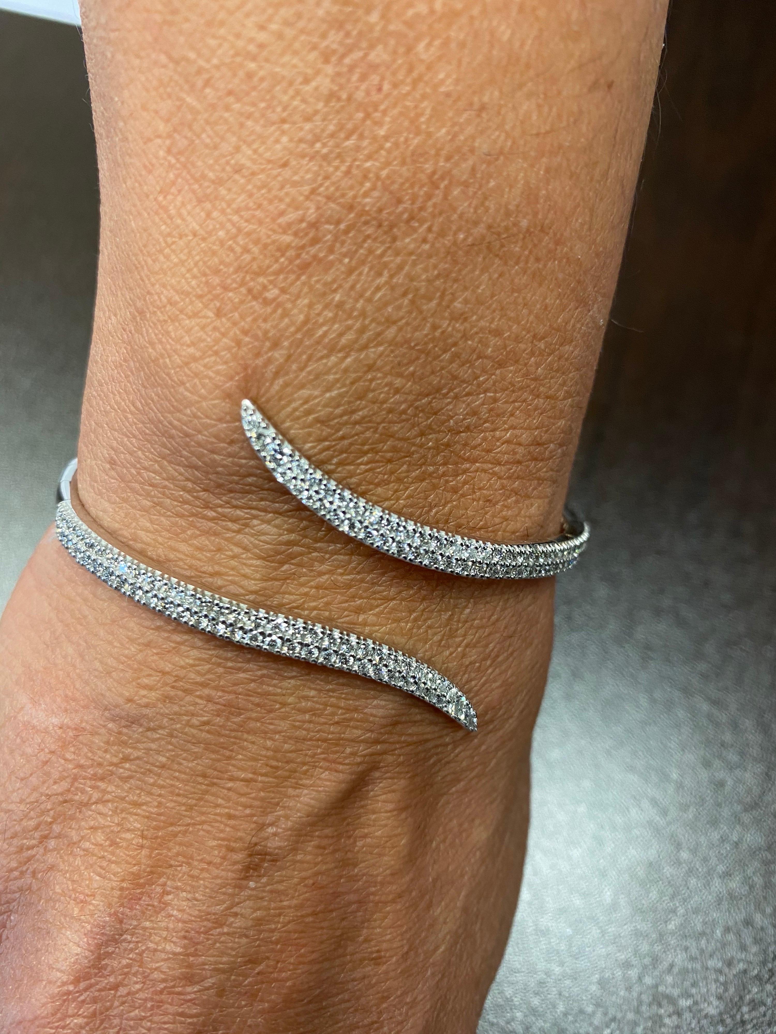 Diamond bangle set in 14K white gold. This italian made piece is set with 2 pointer diamonds, making the total weight 2.05 carats. The color of the stones are G, the clarity is SI1-SI2.