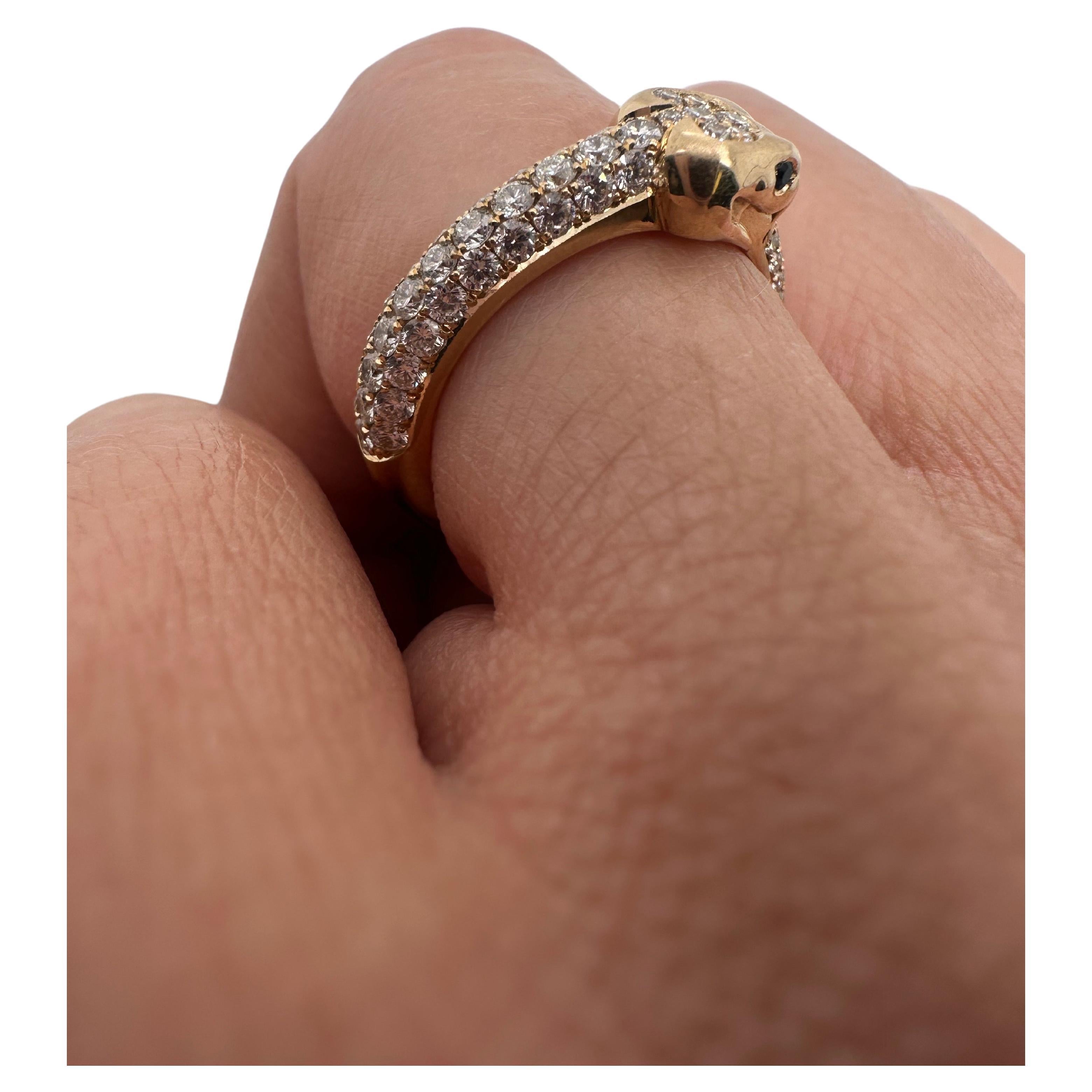 Fantastic craftsmanship on this ring, made by hand from scratch with stunning snake design and natural white diamonds in 18KT yellow gold.

Metal Type: 18KT

Natural Diamond(s): 
Color: F-G-H
Cut:Round Brilliant
Carat: 1.10ct
Clarity: VS-SI