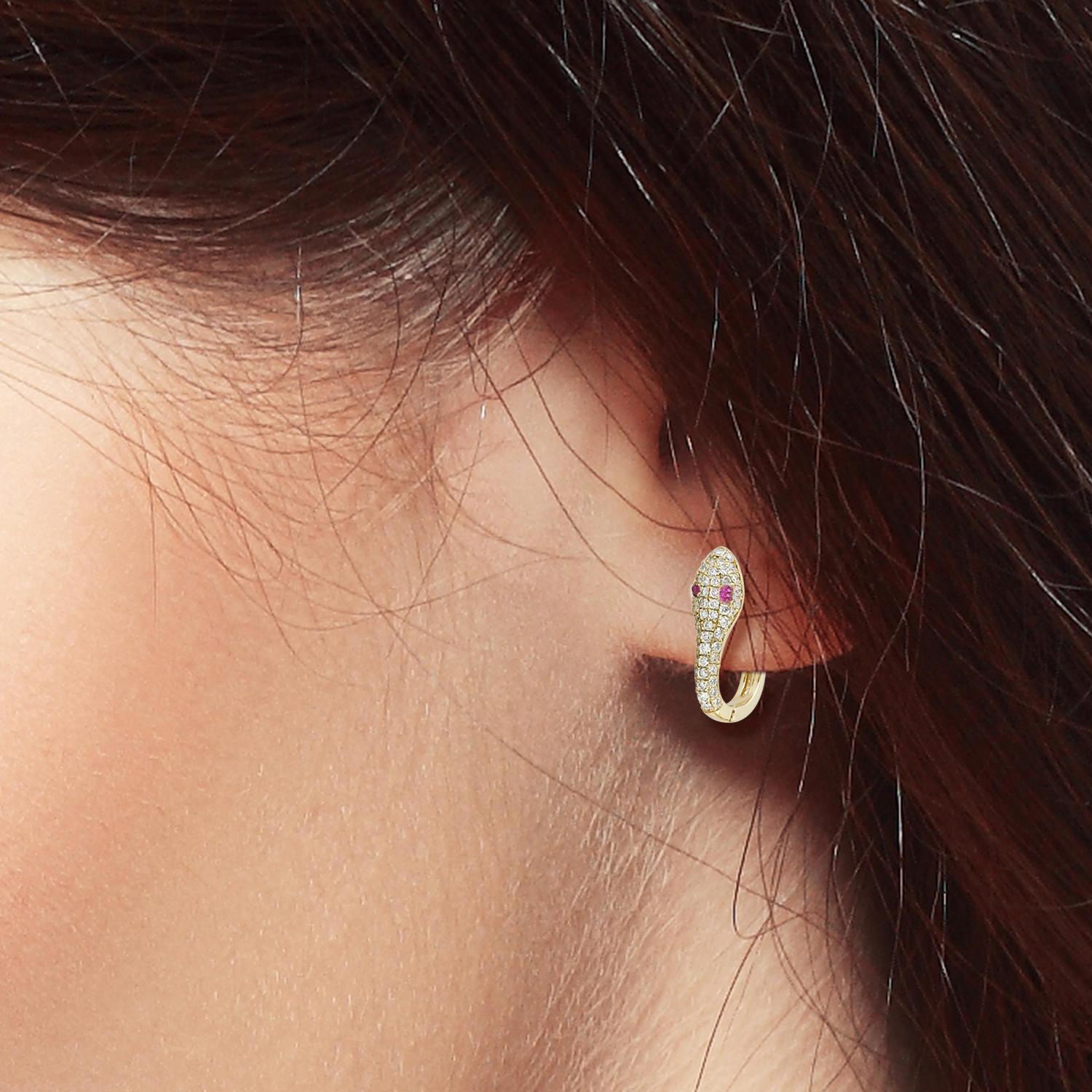 Cast from 14-karat gold, these beautiful huggie earrings are set with .10 carat rubies and .50 carats of brilliant cut diamonds. These playful huggie hoop earrings sit right up against the ear, dainty enough for everyday wear. 

FOLLOW  MEGHNA