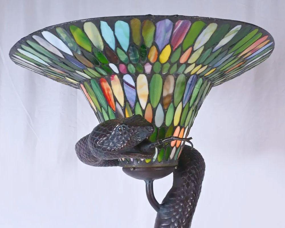 Snake Form bronze floor lamp after original by Edgar Brandt with a very colorful stained glass shade.