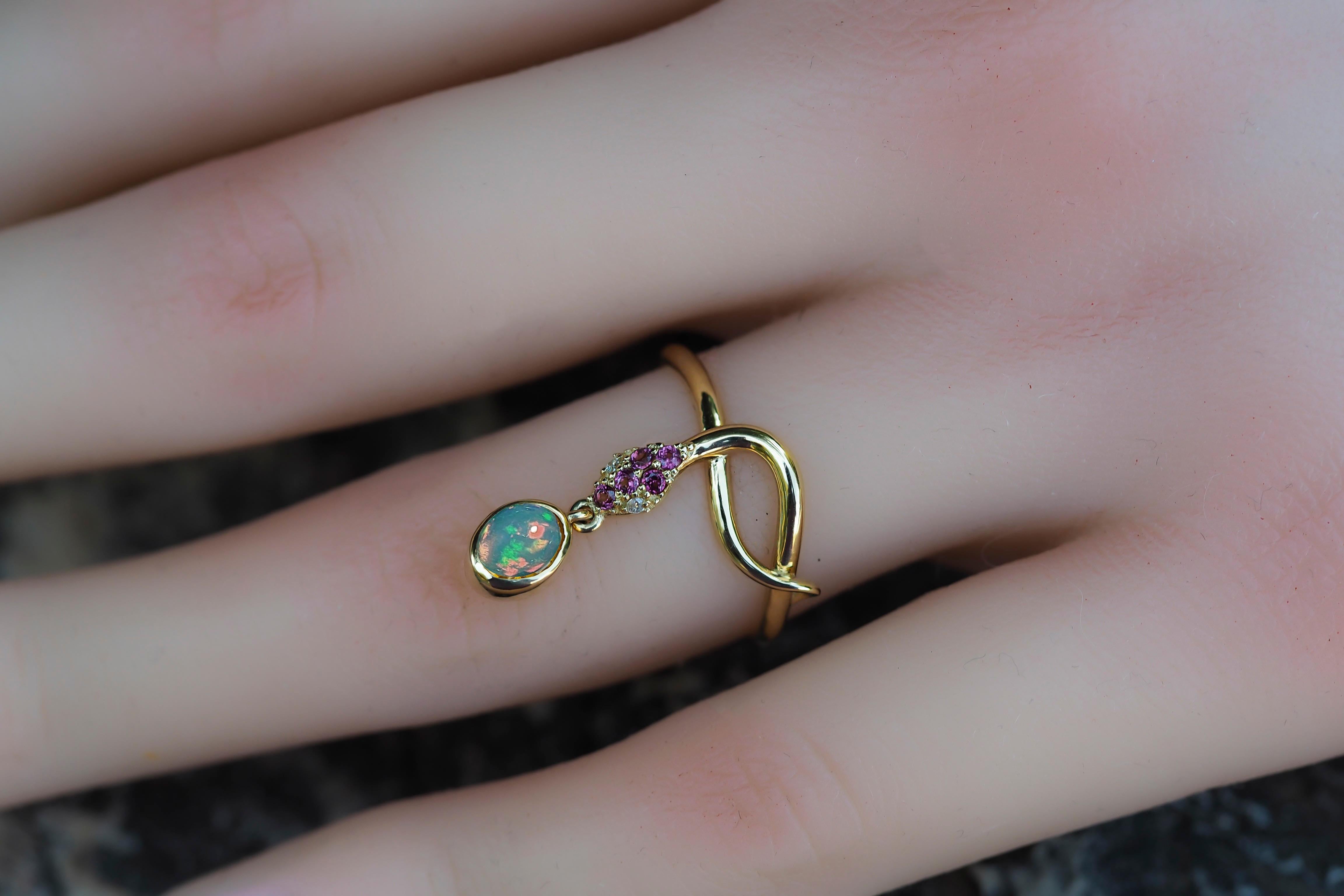 Snake gold ring with Opal. 
Opal 14k gold ring. Snake gold ring. Genuine Opal ring. Oval Opal ring. October birthstone ring. Animal gold ring

Metal: 14k gold.
Weight: 2.25 g. depends from size.

Gemstones:
Opal: color - multicolor (depends from