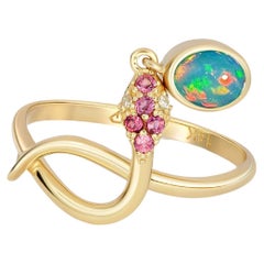 Snake gold ring with Opal. 