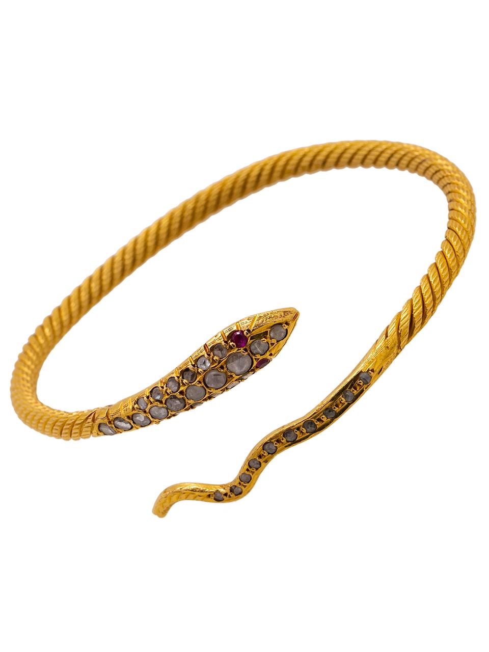 
22K Yellow Gold Serpent design bracelet with twisted cross hatched texture and Egyptian hallmarks. Serpent head and tail decorated with rose cut diamonds, eyes set with rubies. Overall weight 32.3 grams. Can be worn on the wrist, or higher up on