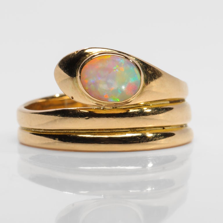 It was the flash of the opal I saw first. I was leaving the store, having paid for my new (very old) three rings when a flash of red, then yellow caught my eye. When she removed the ring from the case I said, I'll take that, too. The ring took me,