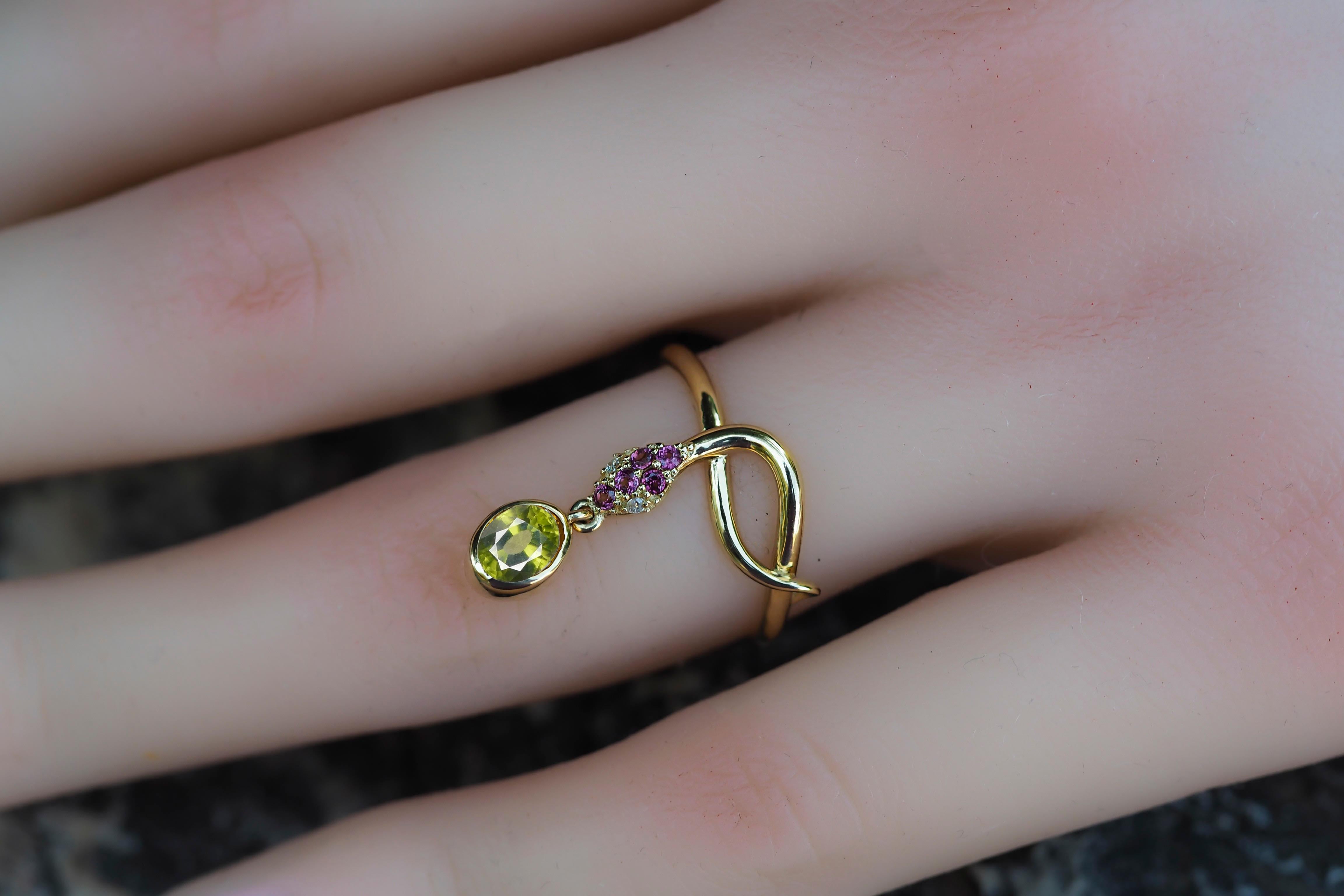 Snake ring with Peridot. 
Peridot gold ring. Snake gold ring. Genuine Peridot ring. Oval Peridot ring. October birthstone ring.

Metal: 14k gold.
Weight: 2.25 g. depends from size.

Gemstones:
Peridot: color - apple green, olive green
Oval cut, 0.8