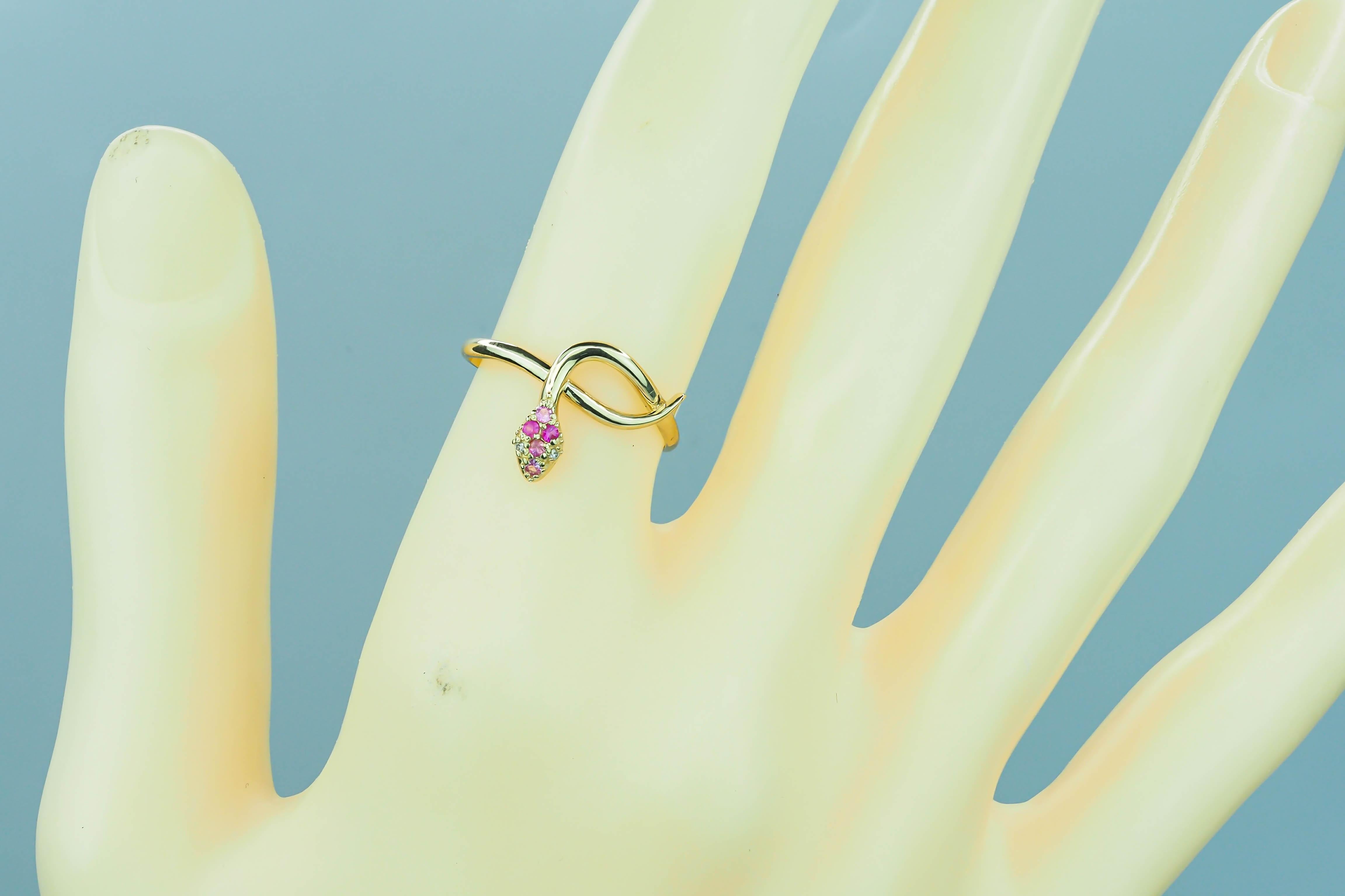 Modern Snake ring with pink sapphire, diamonds.  For Sale