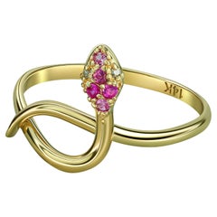 Snake ring with pink sapphire, diamonds. 
