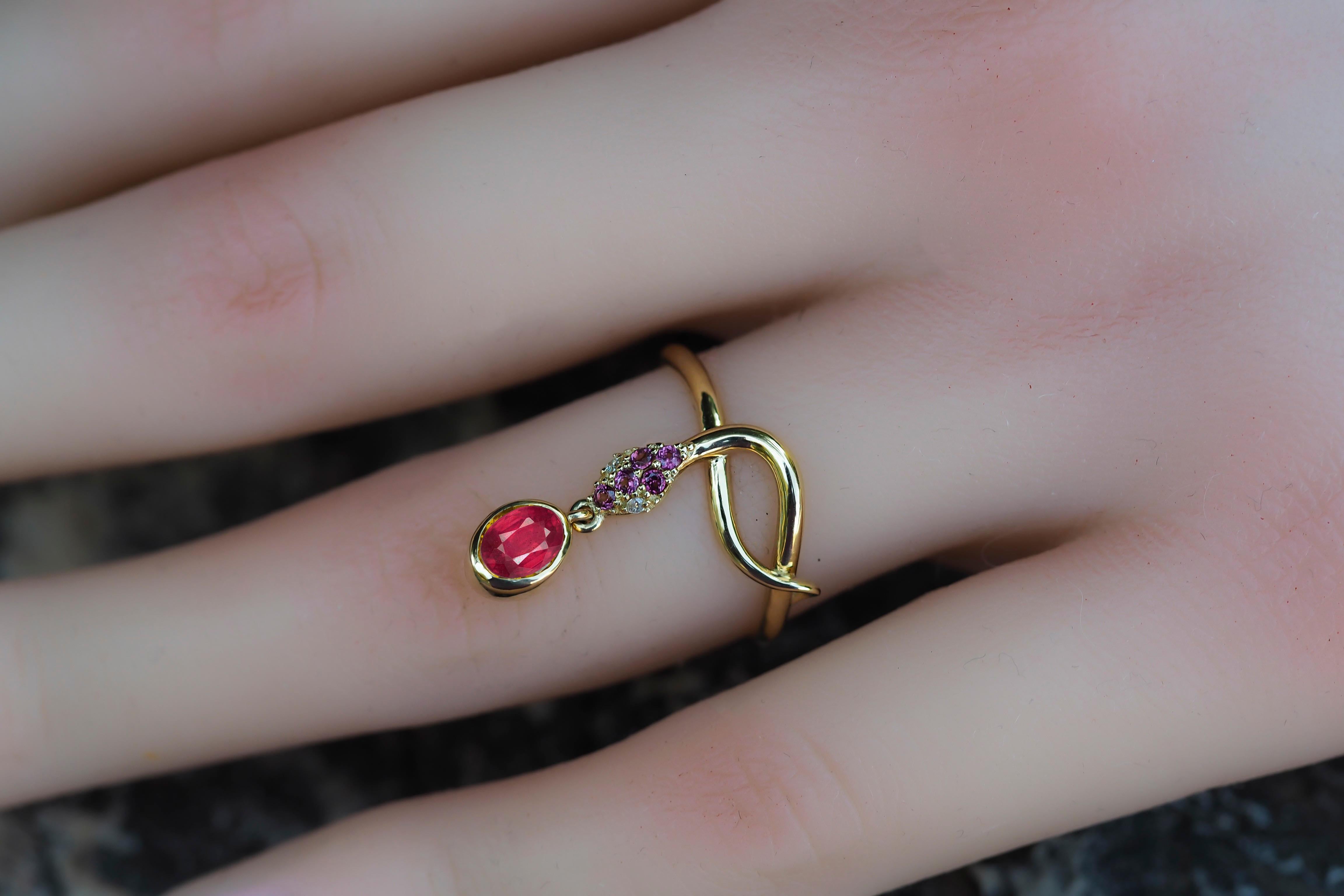 Snake ring with Ruby. 
Ruby gold ring. Snake gold ring. Genuine Ruby ring. Oval Ruby ring. July birthstone ring.

Metal: 14k gold.
Weight: 2.25 g. depends from size.

Gemstones:
Ruby: color - red
Oval cut, 0.8 ct. approx
Clarity: Transparent with