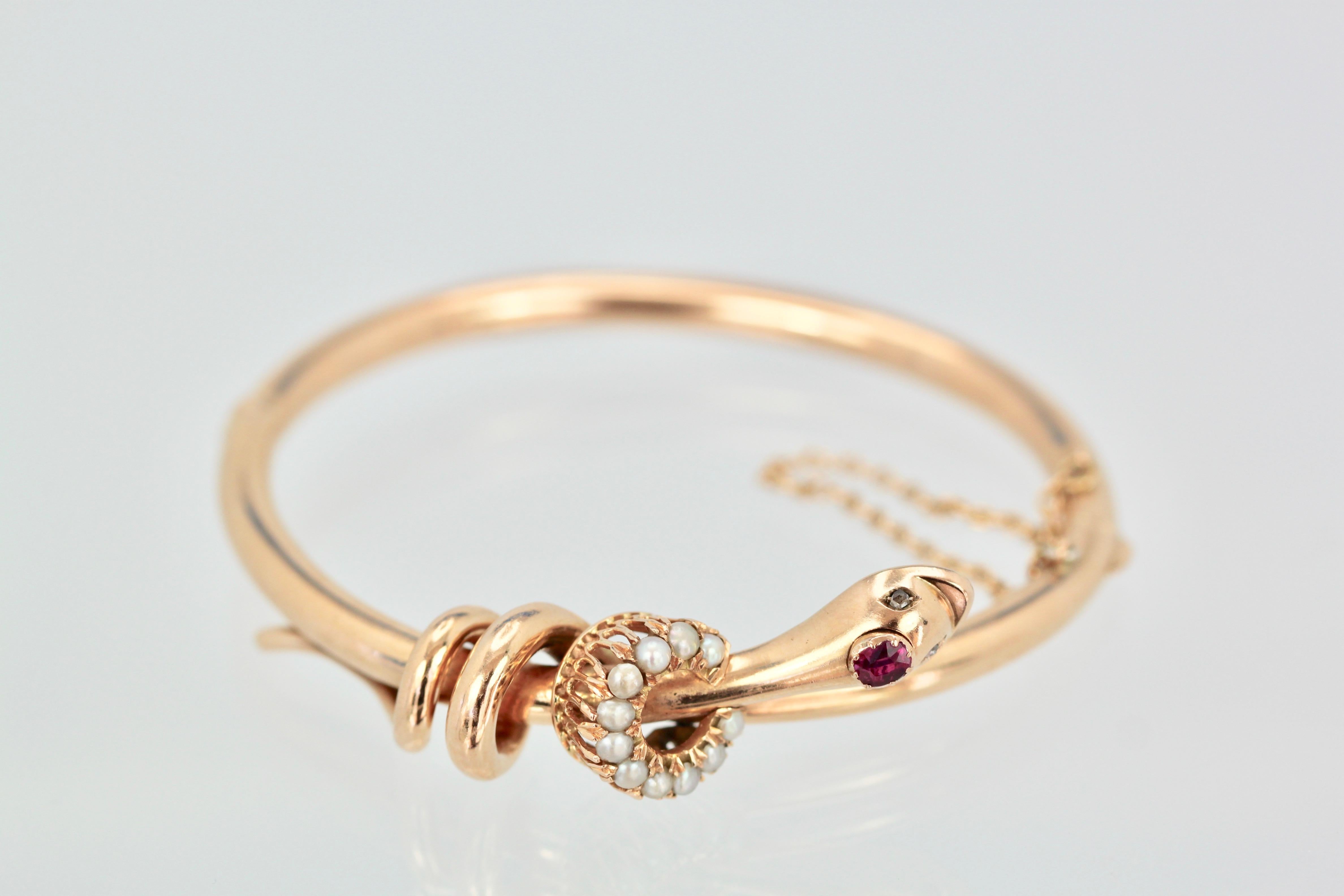 This Snake Serpent Bracelet with Ruby Head Pearl Collar in 18K yellow gold comes out of France and is unique. As many of you know I collect every lovely snake bracelet I can find and this one is unique. This snake has a Ruby for the head and a