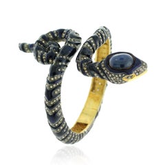 Snake Shaped Blue Sapphire Bangle Accented With Pave Diamonds