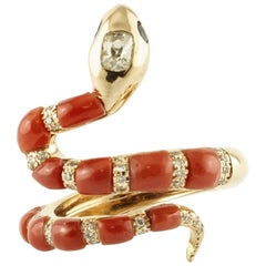 Snake-Shaped Ring in 14 Karat Gold, Rubrum Coral, Diamonds and Blue Sapphires