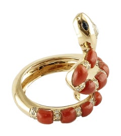 Snake-Shaped Ring in 14 Karat Gold, Rubrum Coral, Diamonds and Blue Sapphires