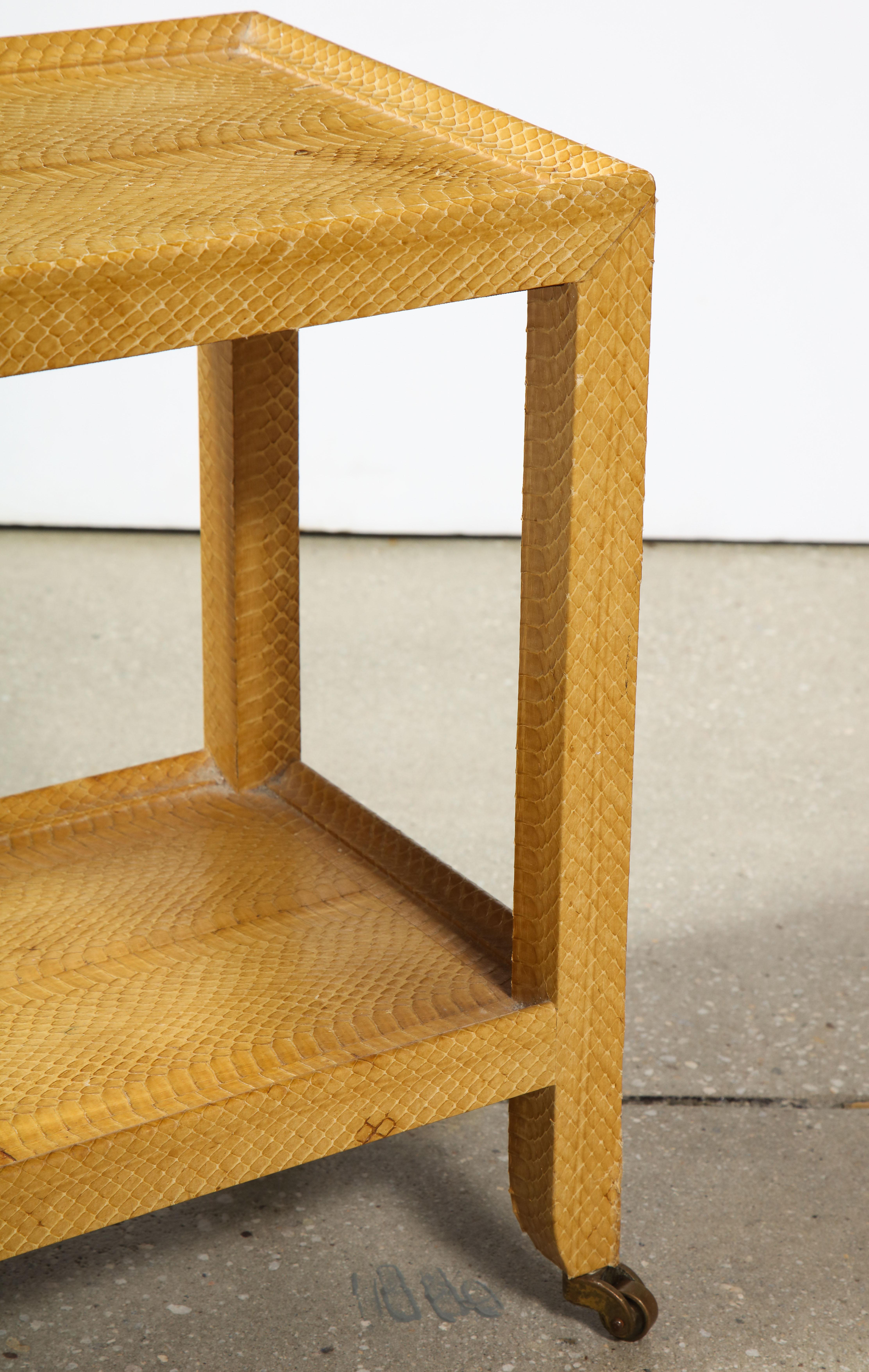 Two-tier snakeskin side table by Karl Springer, Signed.