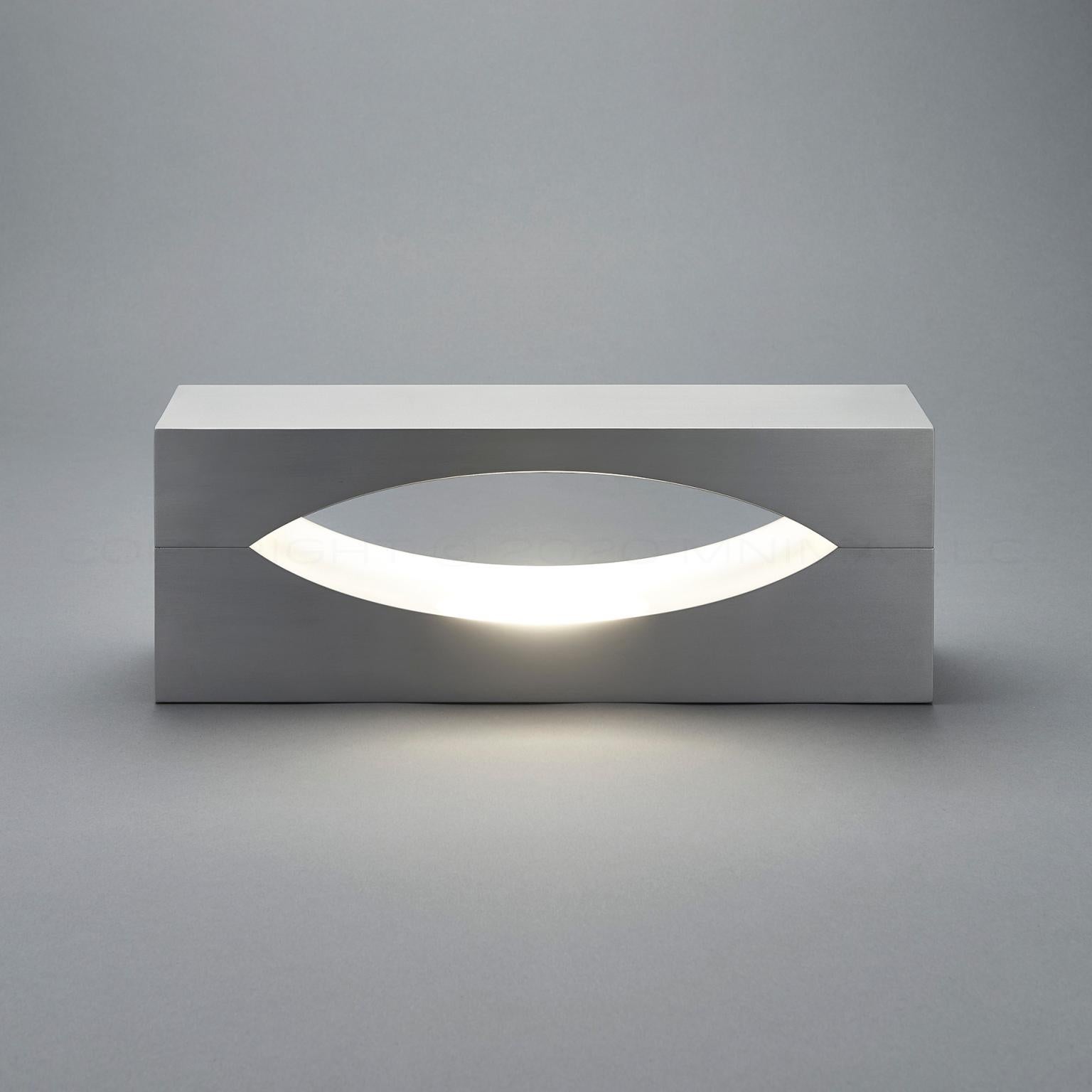 Snakke by mnima. A table light sculpted from solid aluminum. Light illuminates the center cavity before gently spilling into its environment. Modern. Minimal.

Physical
material 6061 aluminum
finish clear anodize shown
weight
