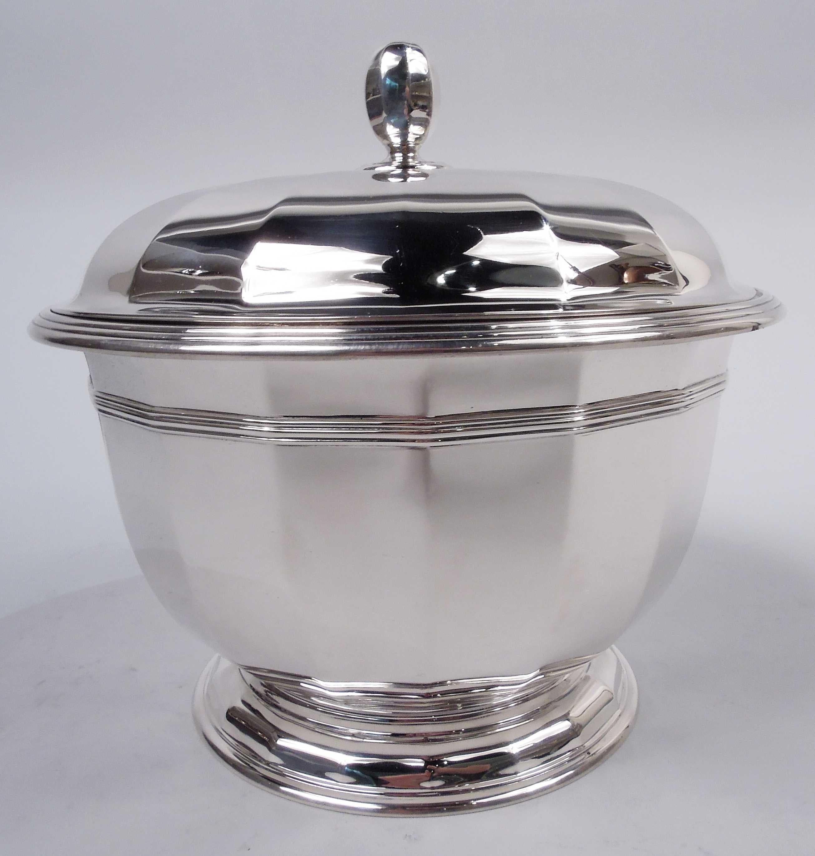 Art Deco sterling silver ice bucket. Made by Tiffany & Co. in New York, ca 1917. Girdled urn on raised foot. Cover raised with ovoid finial. Faceted and reeded. Snazzy with nice shimmer. Fully marked including maker’s stamp, pattern no. 19346 (first