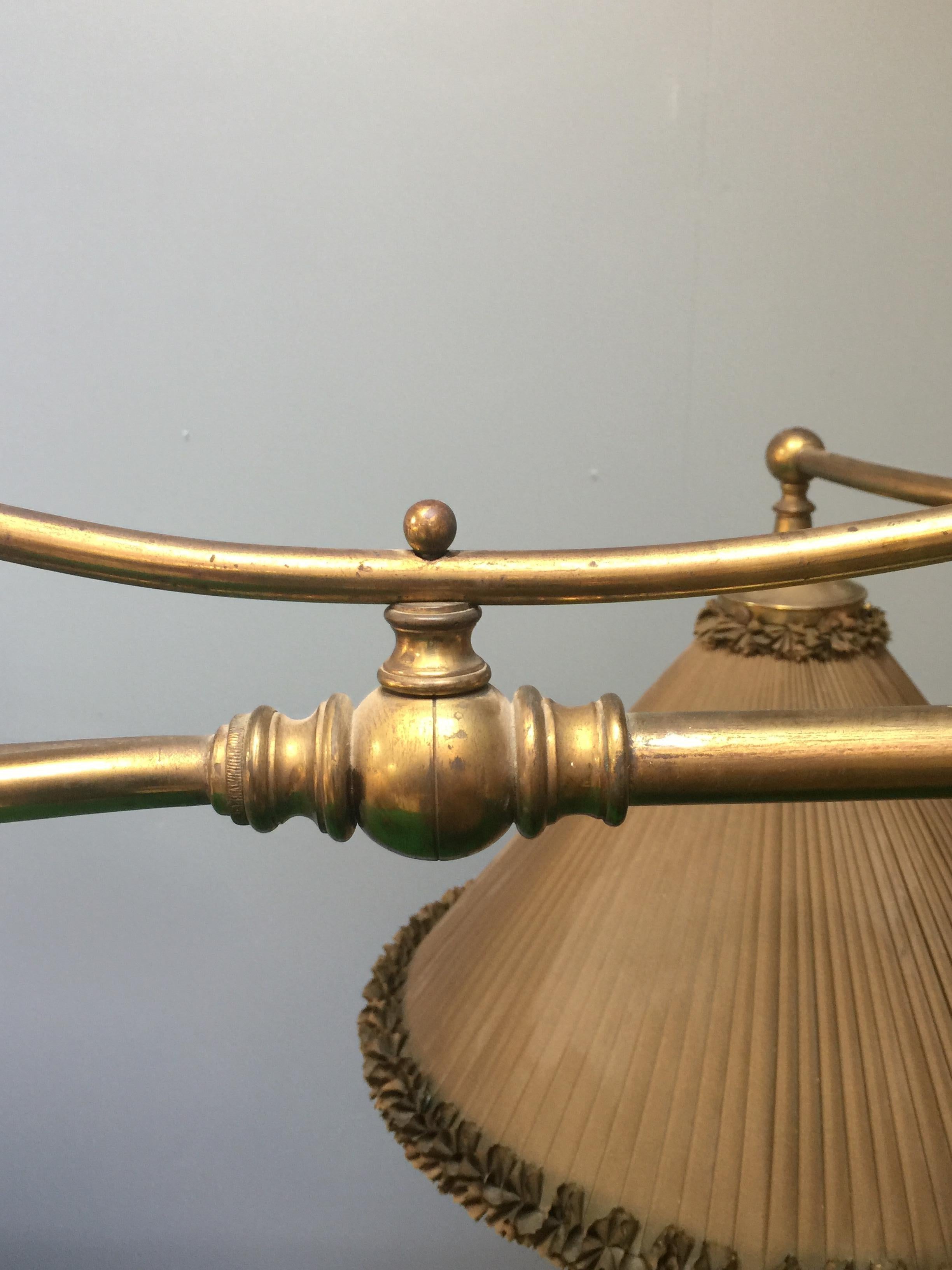 This beautiful brass framed billiard lamp is an original period piece circa 1885, it is of elegant design and features eight hand made silk shades, probably made by Wright of London.

The sweeping arched form is exceptionally rare, the shades are