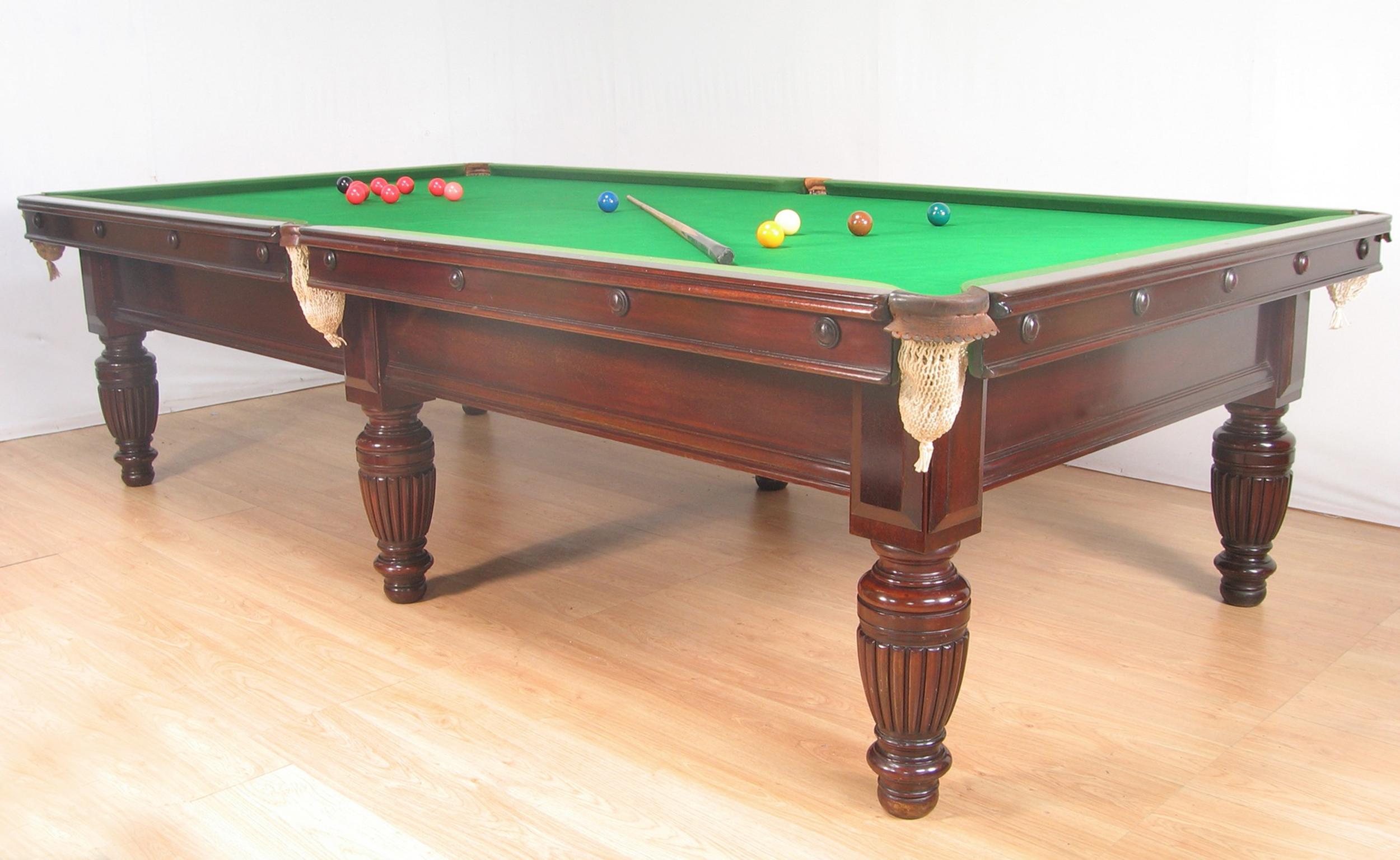 A rare mahogany 10ft x 5ft three quarter sized Billiard table by George Wright of London circa 1890, this table stands on 6 elegant turned and reeded legs made of really good dense grained mahogany with applied bosses to the legs  cushion friezes.