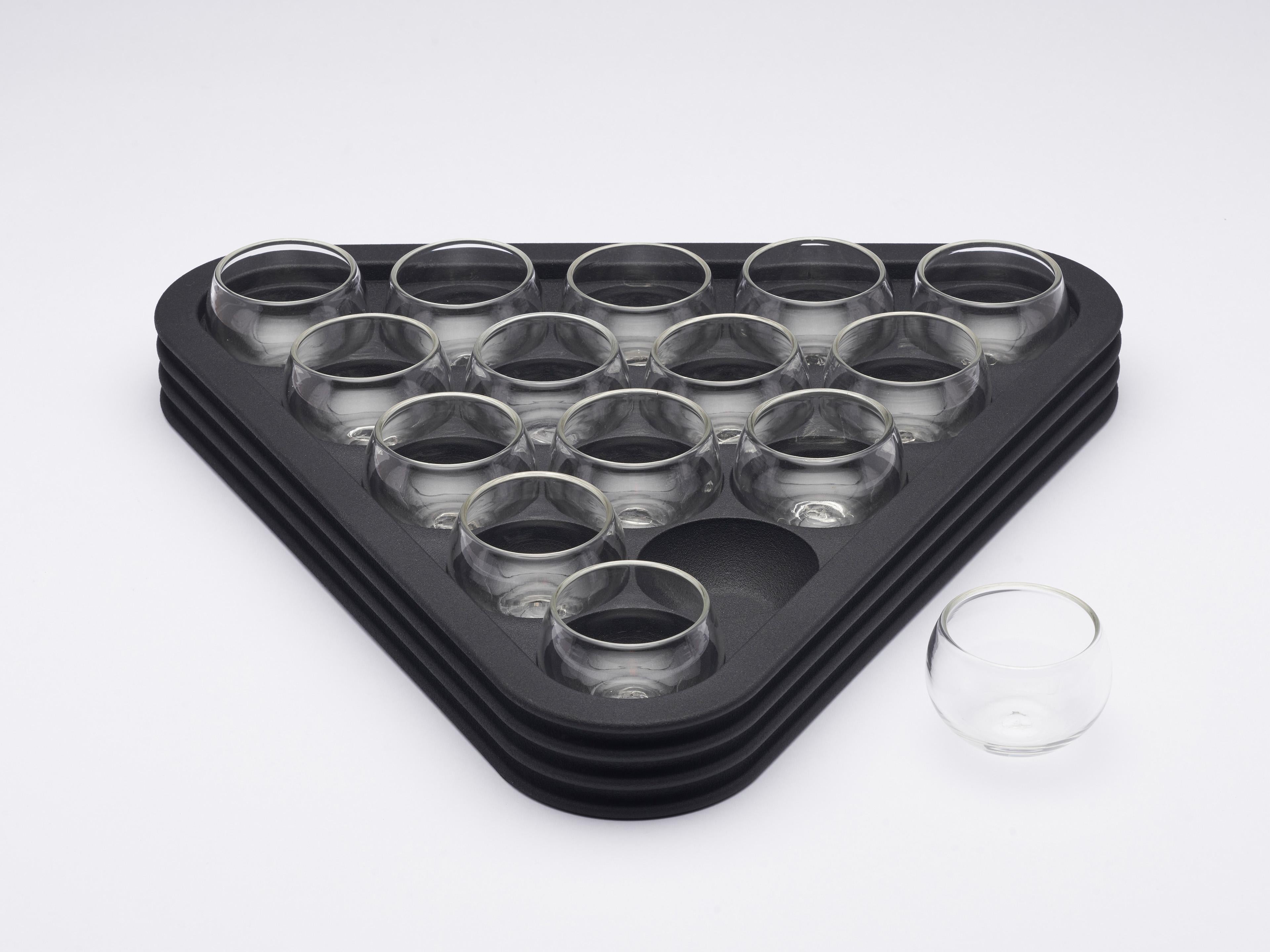 This playful, contemporary drinks serving set is inspired by the games Snooker, Pool, and Billiard’s triangular rack and balls. The shot glasses are hand-blown Murano glass, and the tray is 3D-printed satin black PA12 Nylon.

This intricate object