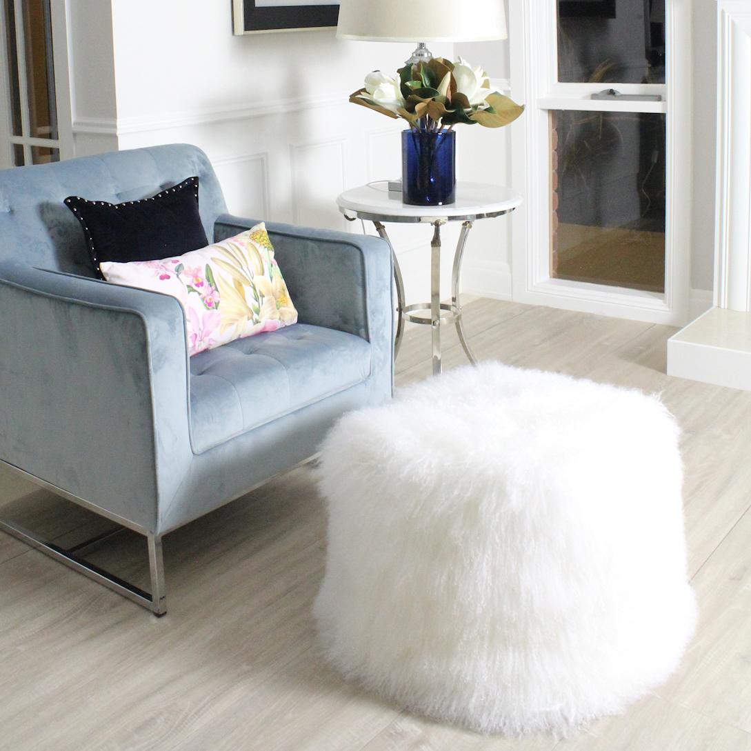 Imagine relaxing with this real fur ottoman! Whether styling a living room for seating or foot comfort or adding a little glam to a bedroom, this snow white Mongolian fur pouf will look and feel amazing in any interior setting. Each fur ottoman