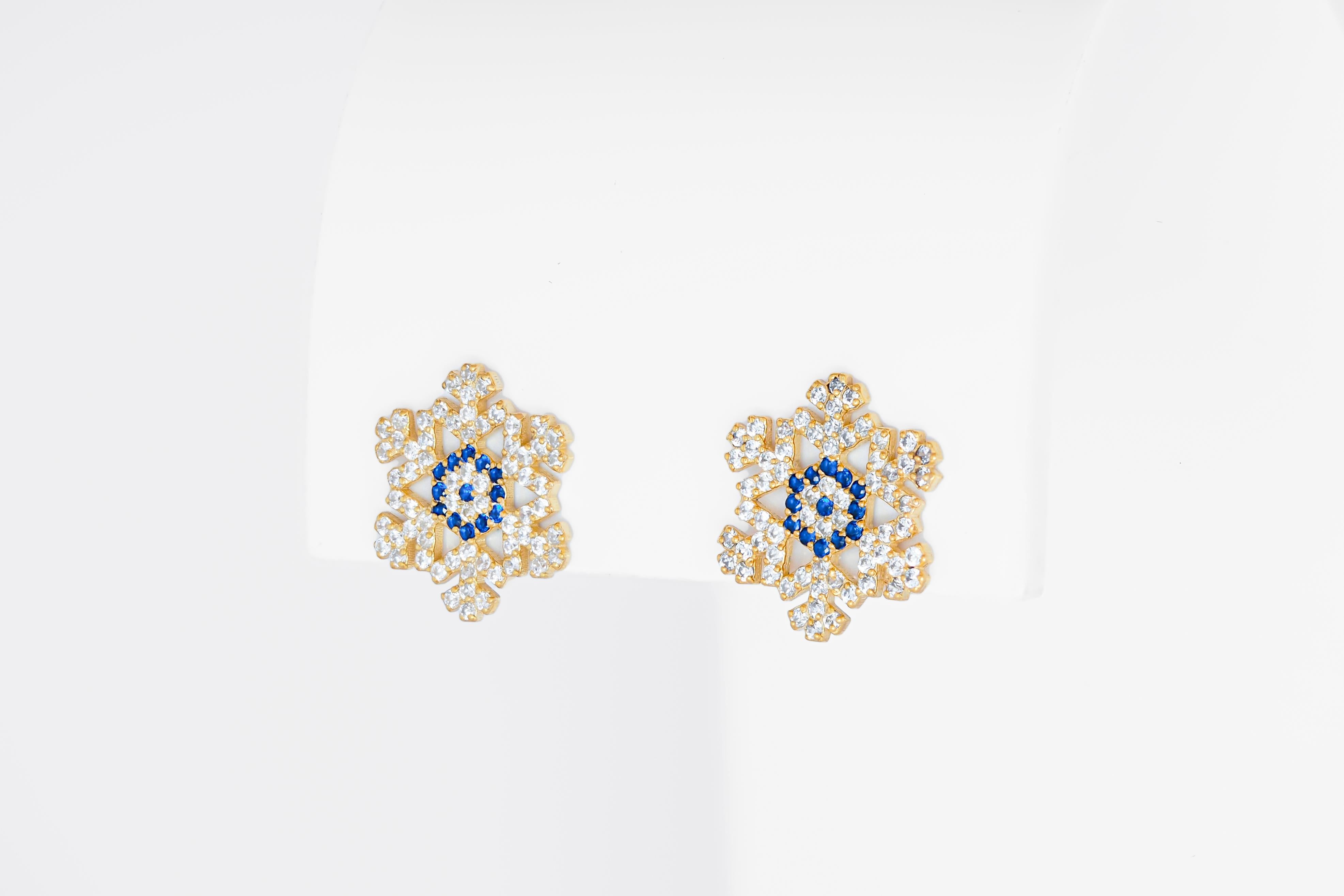 Snowflake 14k gold studs. 
Snow gold Earrings. Christmas Earrings Jewelry. Christmas Present for her. Sparkly gold Earrings. Christmas Tree gold studs. Santa Earrings.

Total weight: 2.2 g.
Metal: 14k solid gold
Gemstones: multicolor sapphires and
