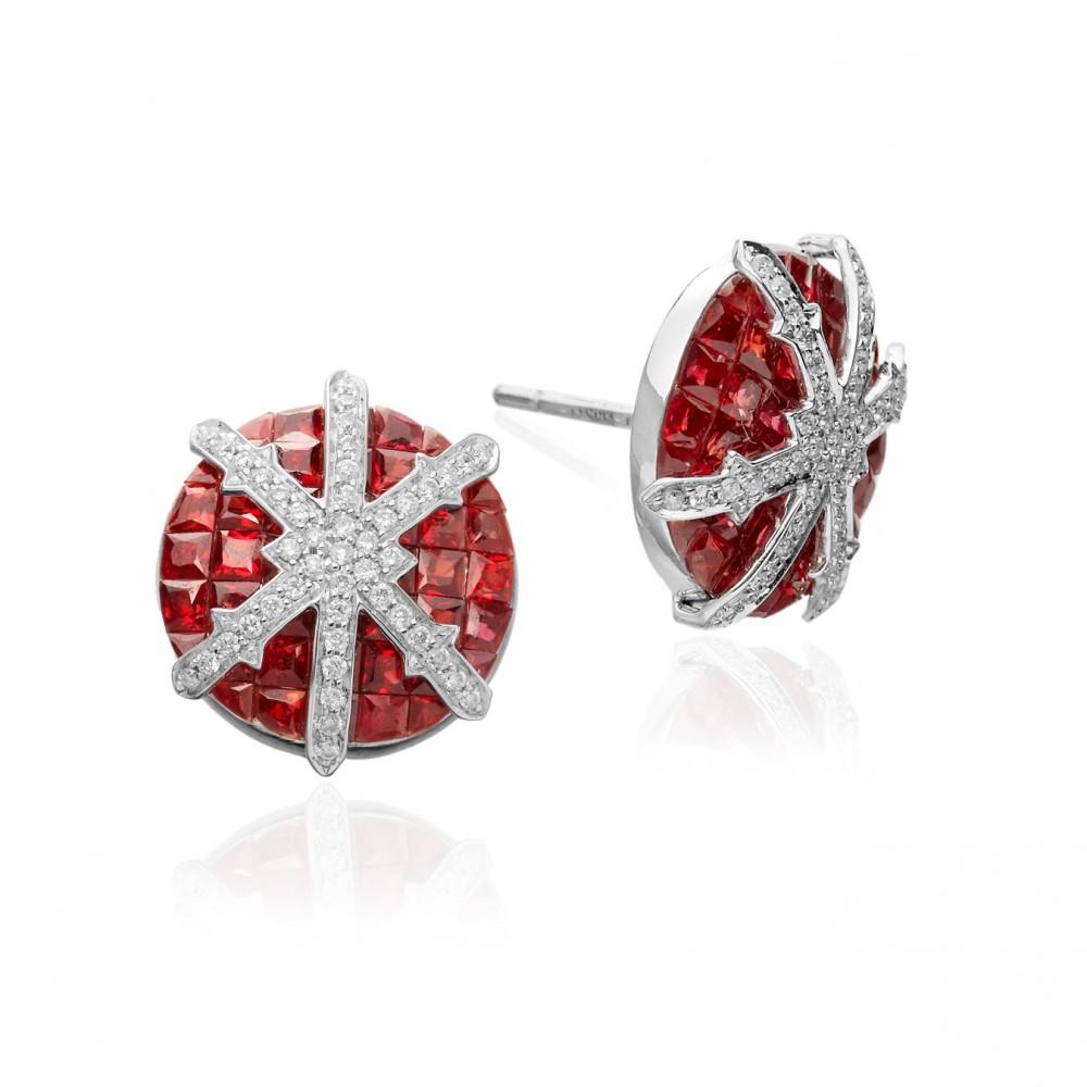 The STENMARK Snowflake stud earrings in rubies, diamonds and 18 karat white gold, feature the elegant Art Deco style gemstone setting technique of invisible setting. The Snowflake earrings are 14 mm in diameter (making them a generous size disc