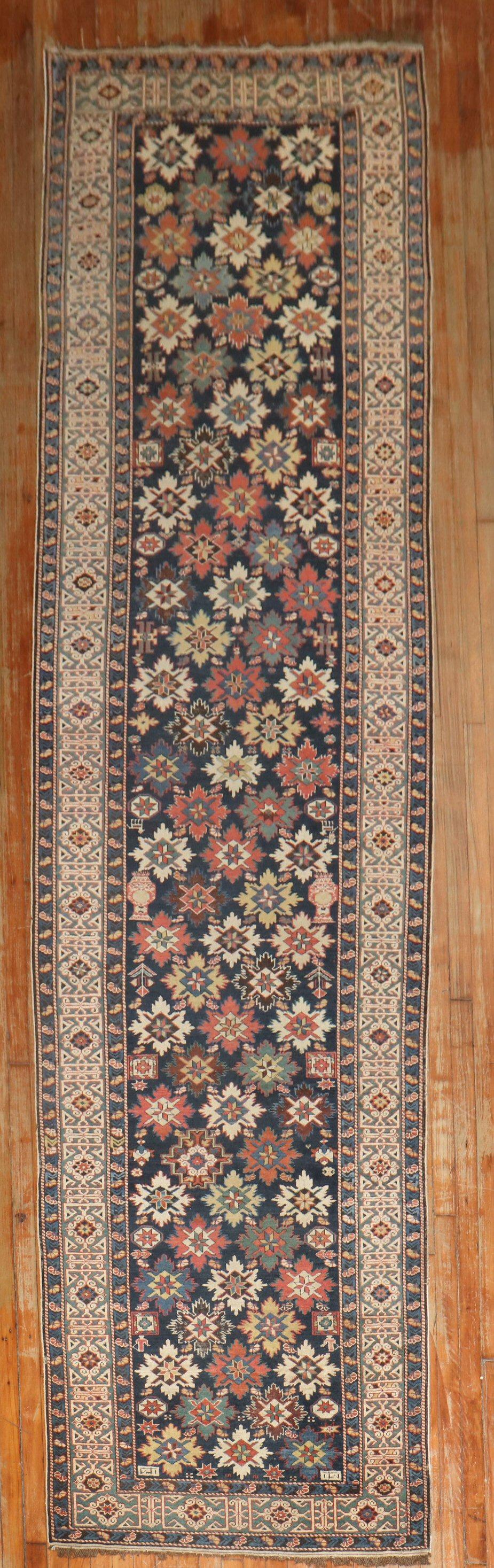 Superb antique Caucasian runner from the late 19th century with a rare all-over snowflake design.

Measures: 3'6