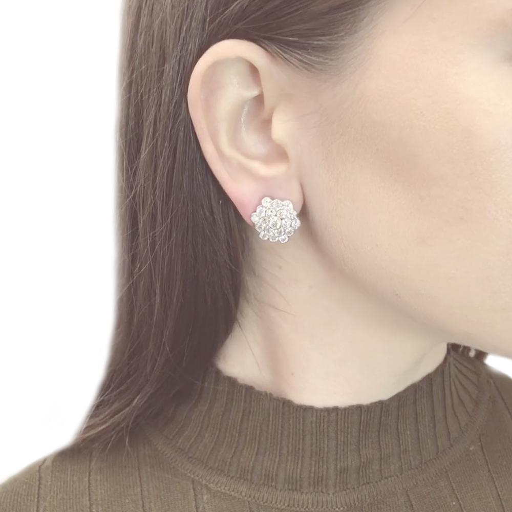 A striking yet modern earrings that captures nature's octagonal snowflake.
Diamonds glisten like white ice and snow set in a flower burst pattern.
Round white diamonds 6.23 ct.
Natural diamonds in G-H Color Clarity VS. 
Platinum 950.
Omega / French