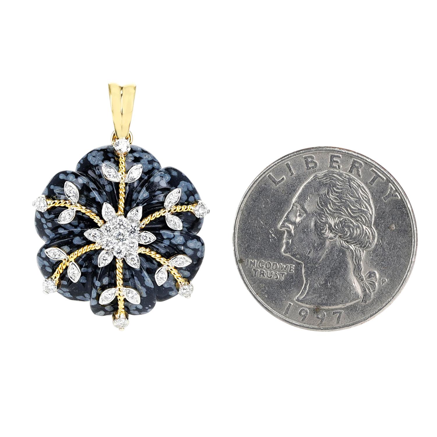 A Snowflake Obsidian Carved Floral Pendant with 14k Gold and Diamonds. Length: 1.10 inches. The total weight of the pendant is 5.40 grams. The snowflake obsidian is appx. 17 carats and the diamonds weigh appx. 0.36 carats. 