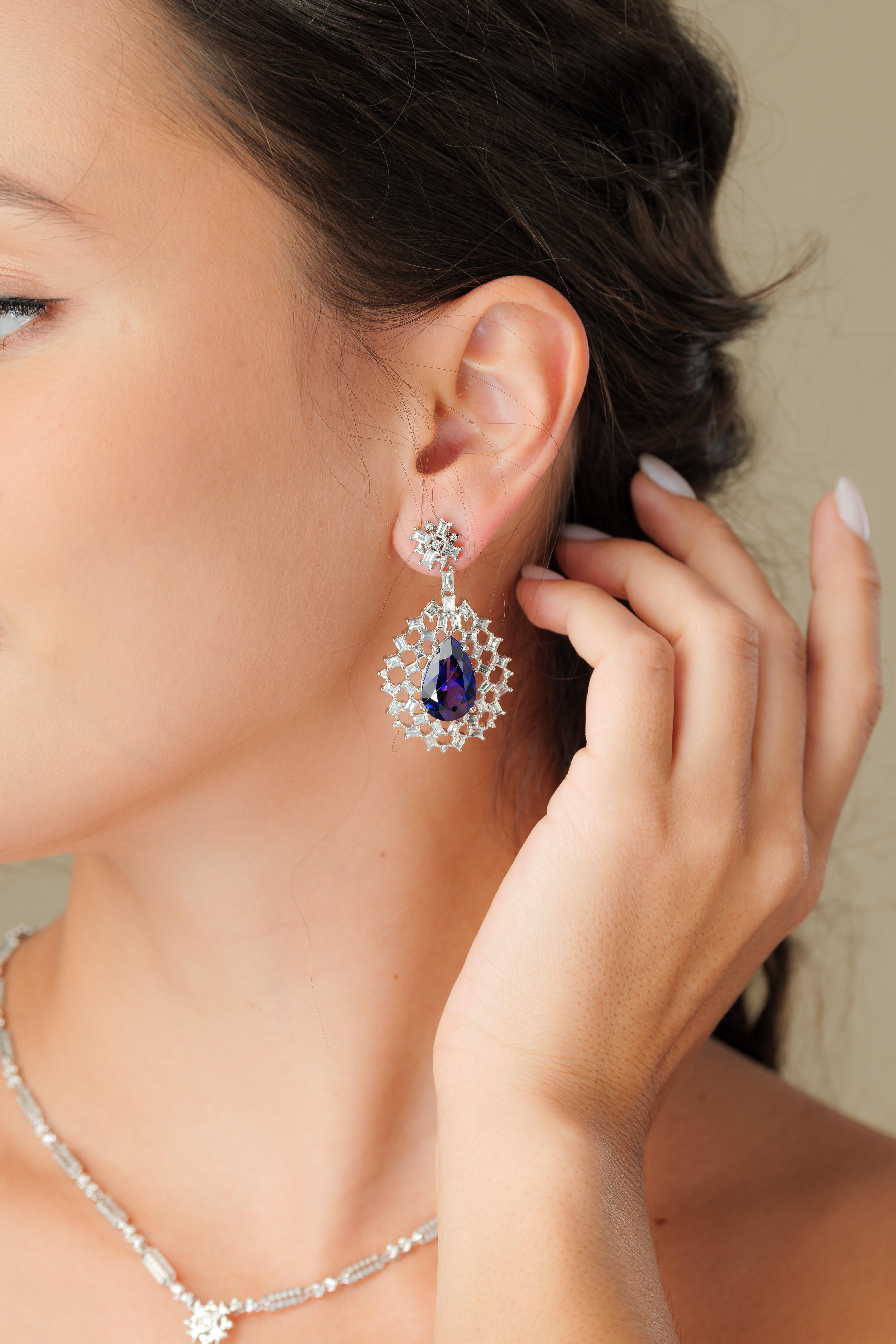Snowflake Tanzanites! This collection features elegant pear shaped Taznzanites that are encompassed by a cage of baguette cut icy white diamonds set in white gold.

Snowflake tanzanite and diamond earrings in 18K white gold. 

Tanzanite: 18.85 carat