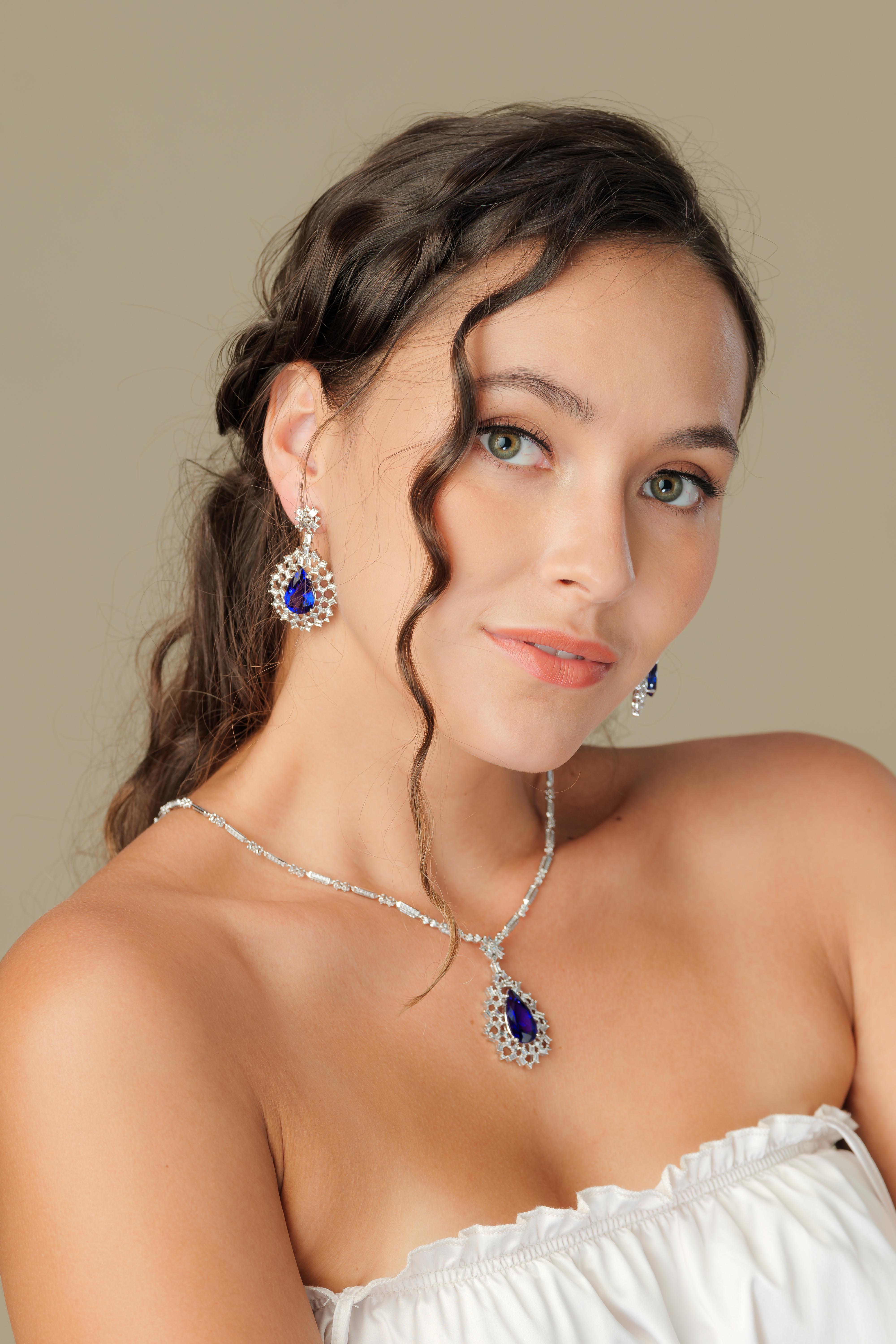 Snowflake Tanzanites! This collection features elegant pear shaped Taznzanites that are encompassed by a cage of baguette cut icy white diamonds set in white gold.

Snowflake tanzanite and diamond earrings in 18K white gold. 

Tanzanite: 18.85 carat
