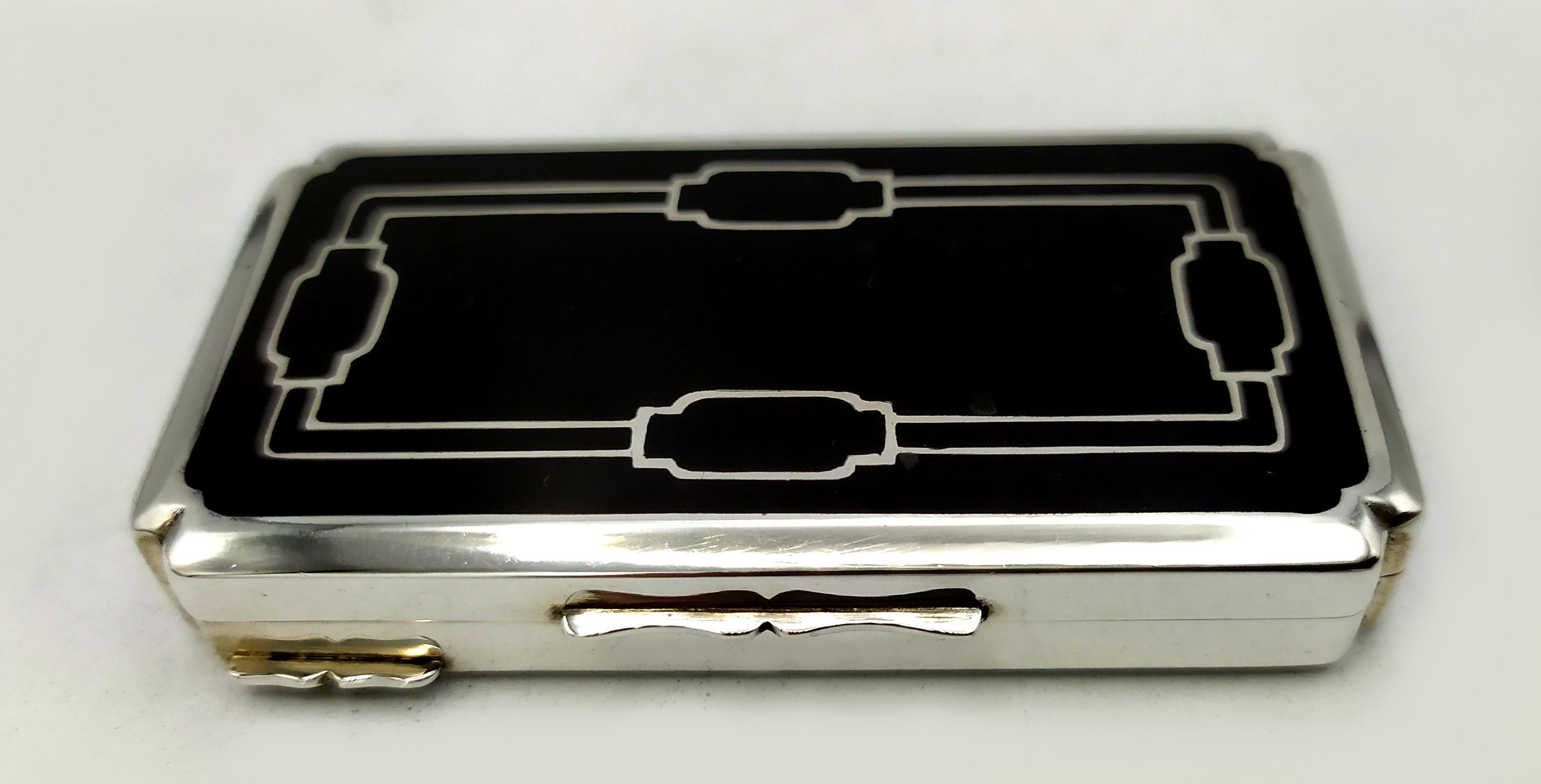 Snuff Box Silver is in 925/1000 sterling.
Snuff Box Silver has black fired enamels on guilloché.
Snuff Box Silver has  a lid with geometric design engraved by hand.
Snuff Box Silver Sterling is in Art Deco style.
Dimensions cm. 4 x 7.7 x 1.3. Weight