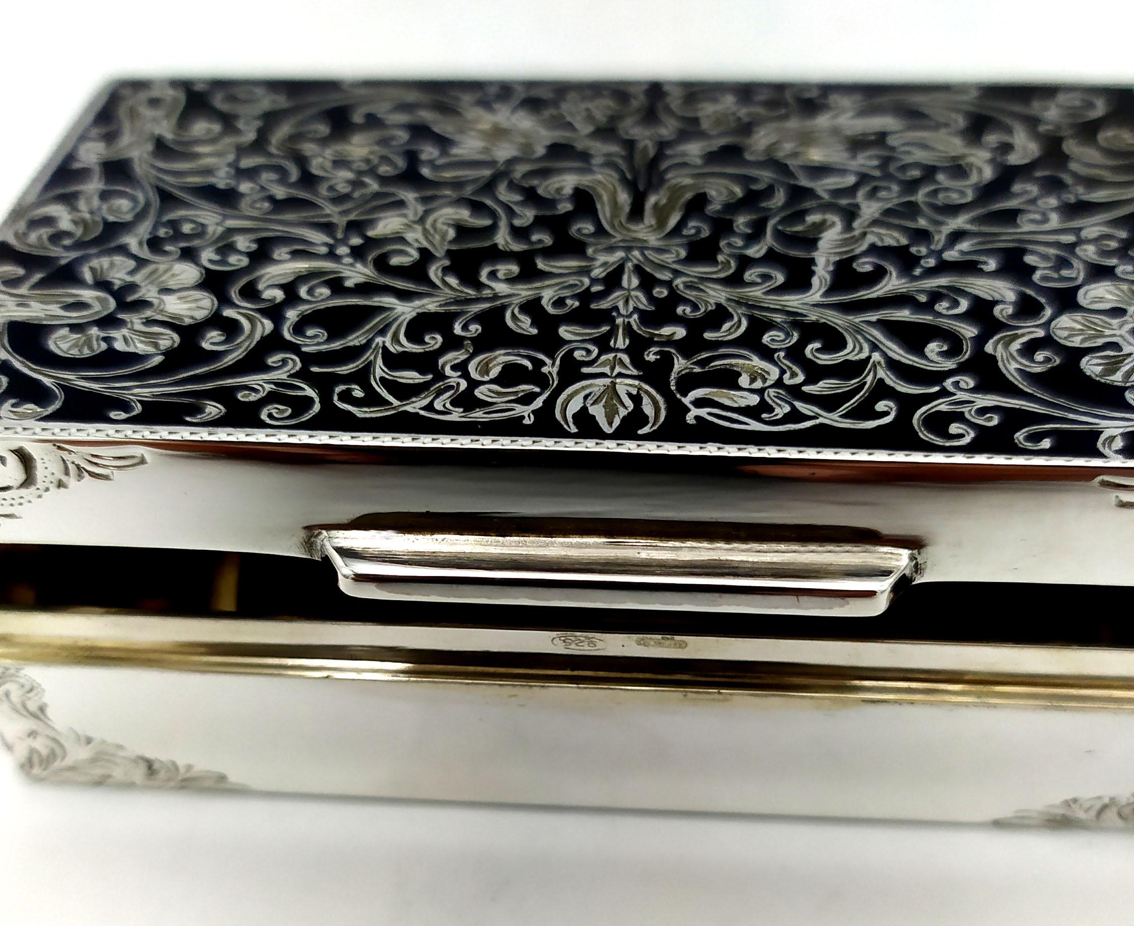 Snuff Box rectangular in 925/1000 sterling silver with fine hand engraving, black fired enameled “niello” type, in early 19th century “Rococo” style. Snuff Box measurements cm. 4.5 x 7.7 x 2. Weight gr. 126. Designed by Franco Salimbeni in 1981 and