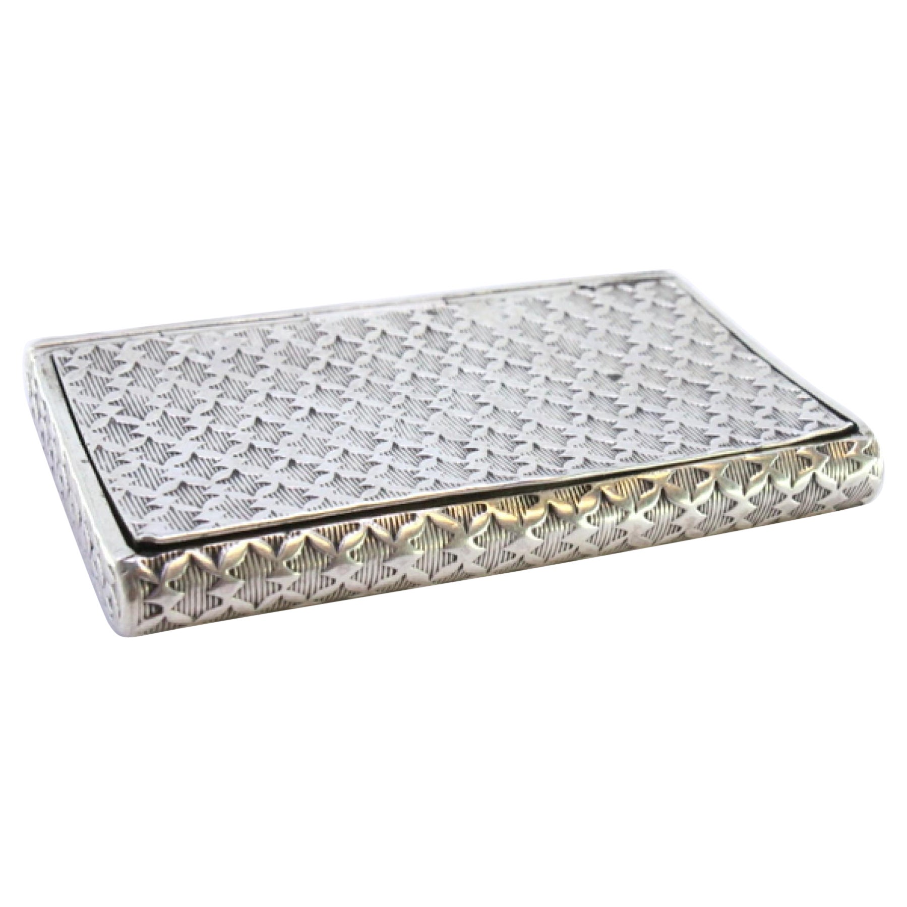 Snuff box in embossed silver with a curved shape and hinged lid