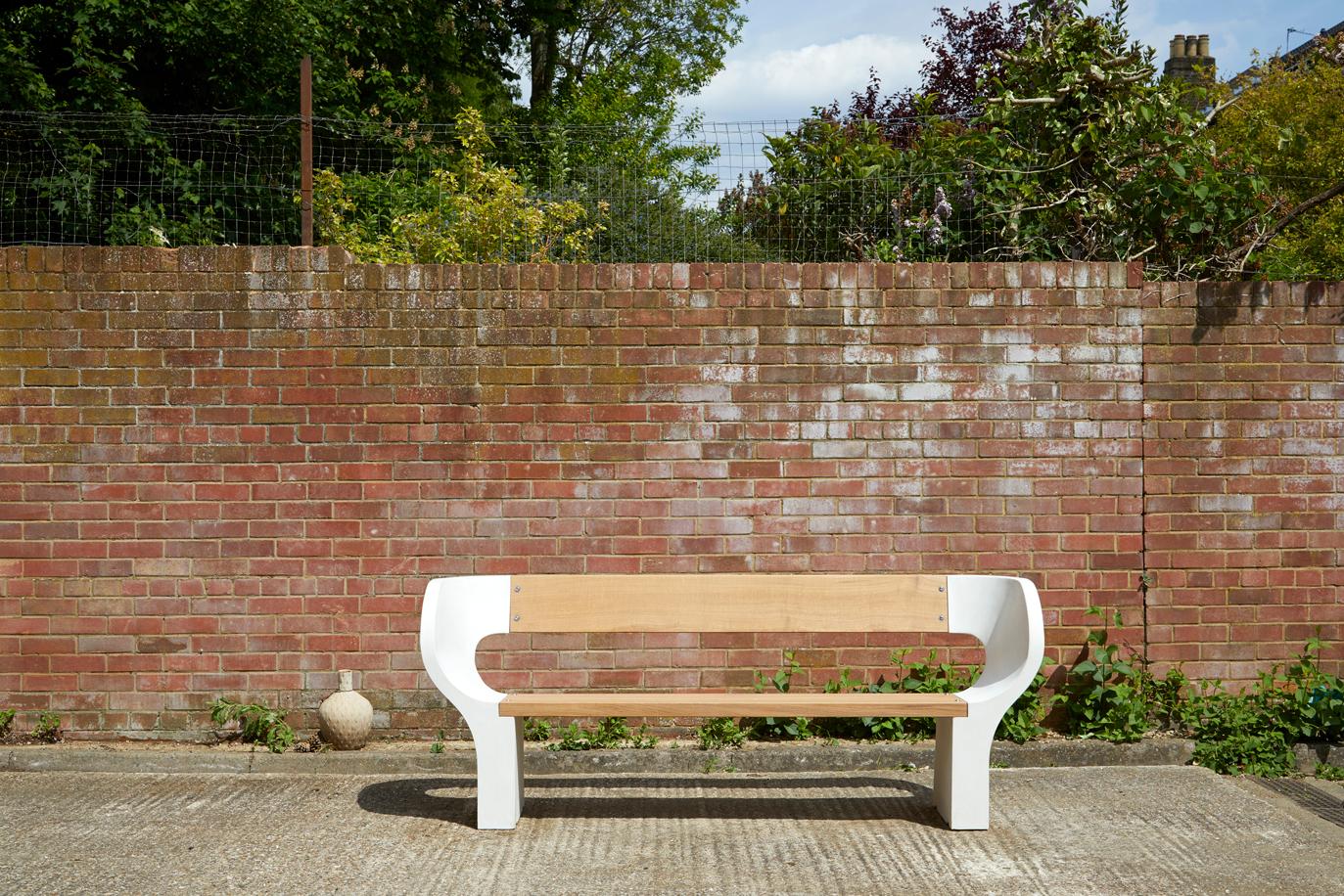 The snug bench available in three widths, 120cm, 160cm and 200cm. This striking sculptural bench, handcrafted for either the outdoors or inside is made out of glass-reinforced concrete and European oak.

Glass-reinforced concrete considerably