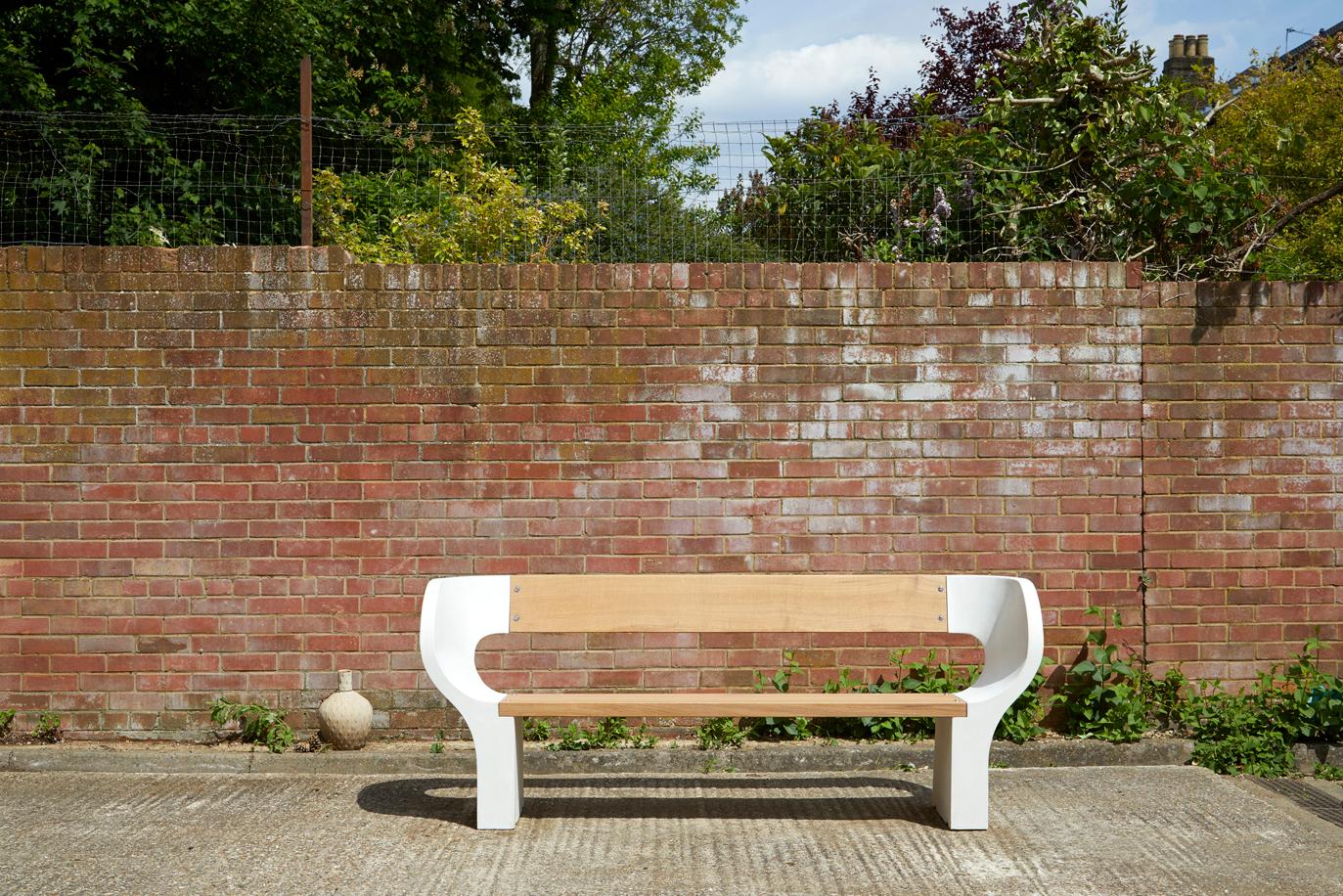 The Snug bench available in three widths, 150cm, 180cm and 200cm. This striking sculptural bench, handcrafted for either the outdoors or inside is made out of glass-reinforced concrete and European oak.

Glass-reinforced concrete considerably