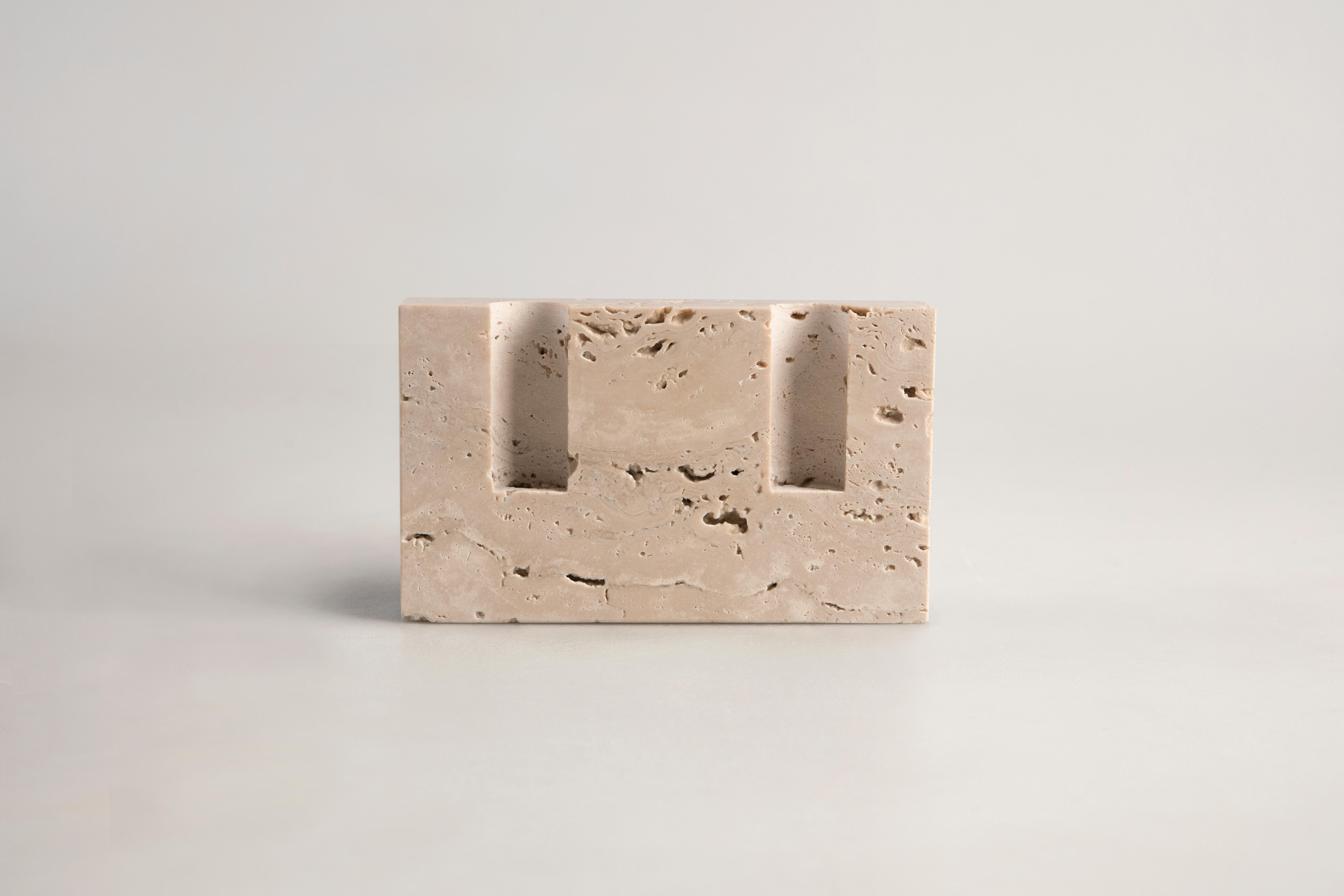 Handcrafted candle holder in Roman travertine with smooth front and sides. Please note that each stone is unique and reacts differently, therefore important variations in colour, shape and texture occur. 

Snug candle holders by Sanna Völker are